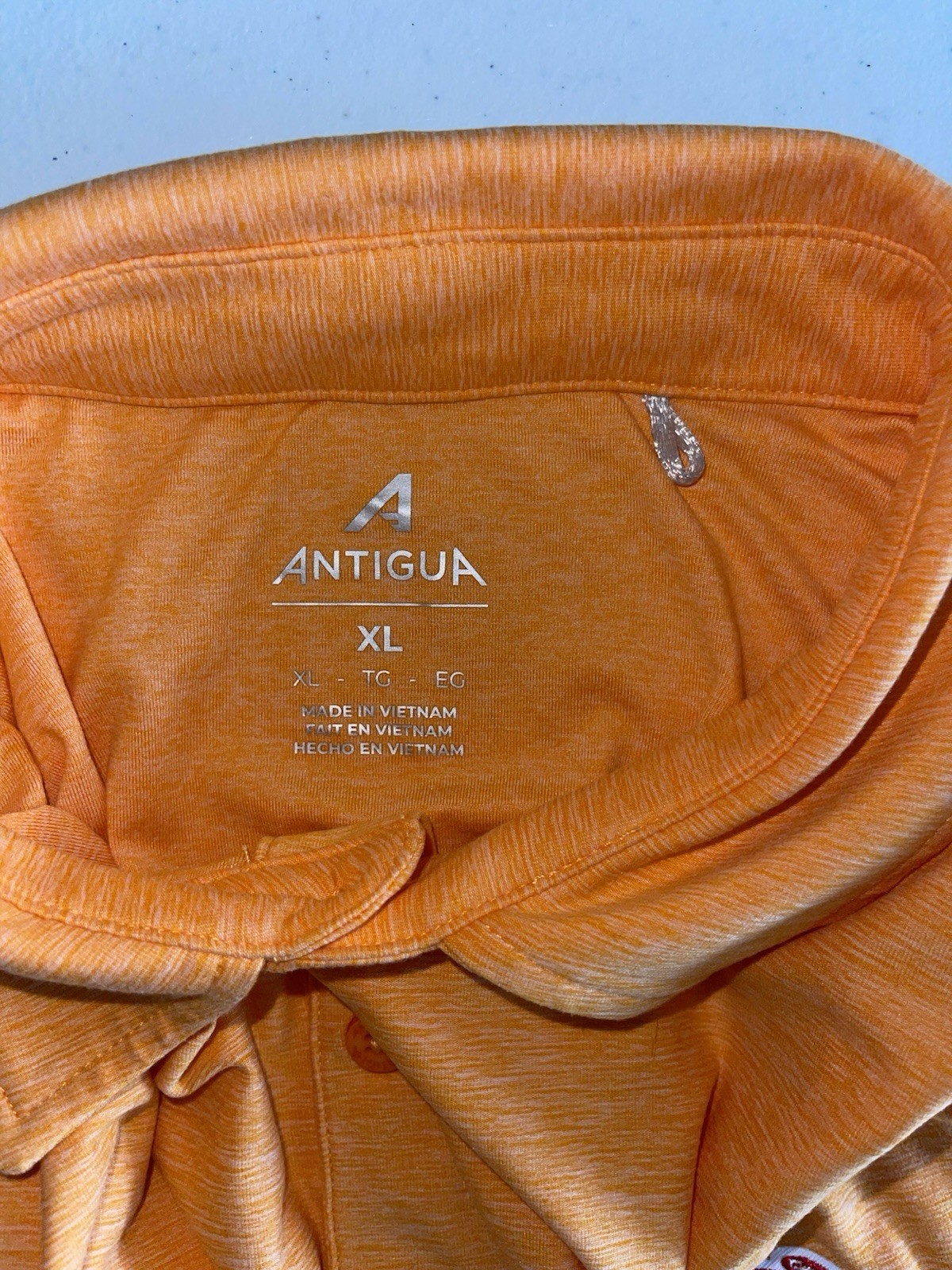 Antigua Men’s Orange Heather Polo with Embroidered Team Crest