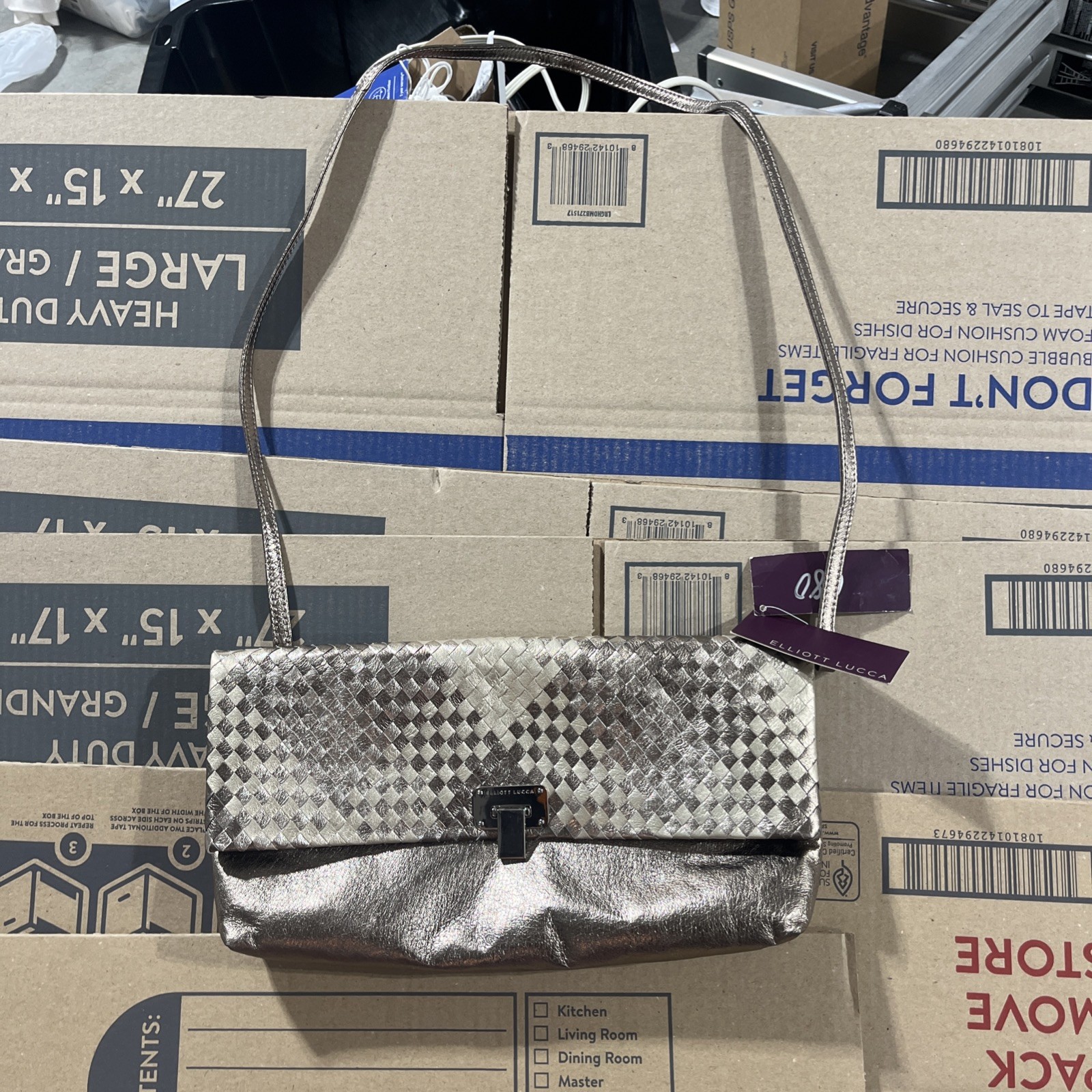 Elliott Lucca metallic woven leather convertible clutch/crossbody bag.