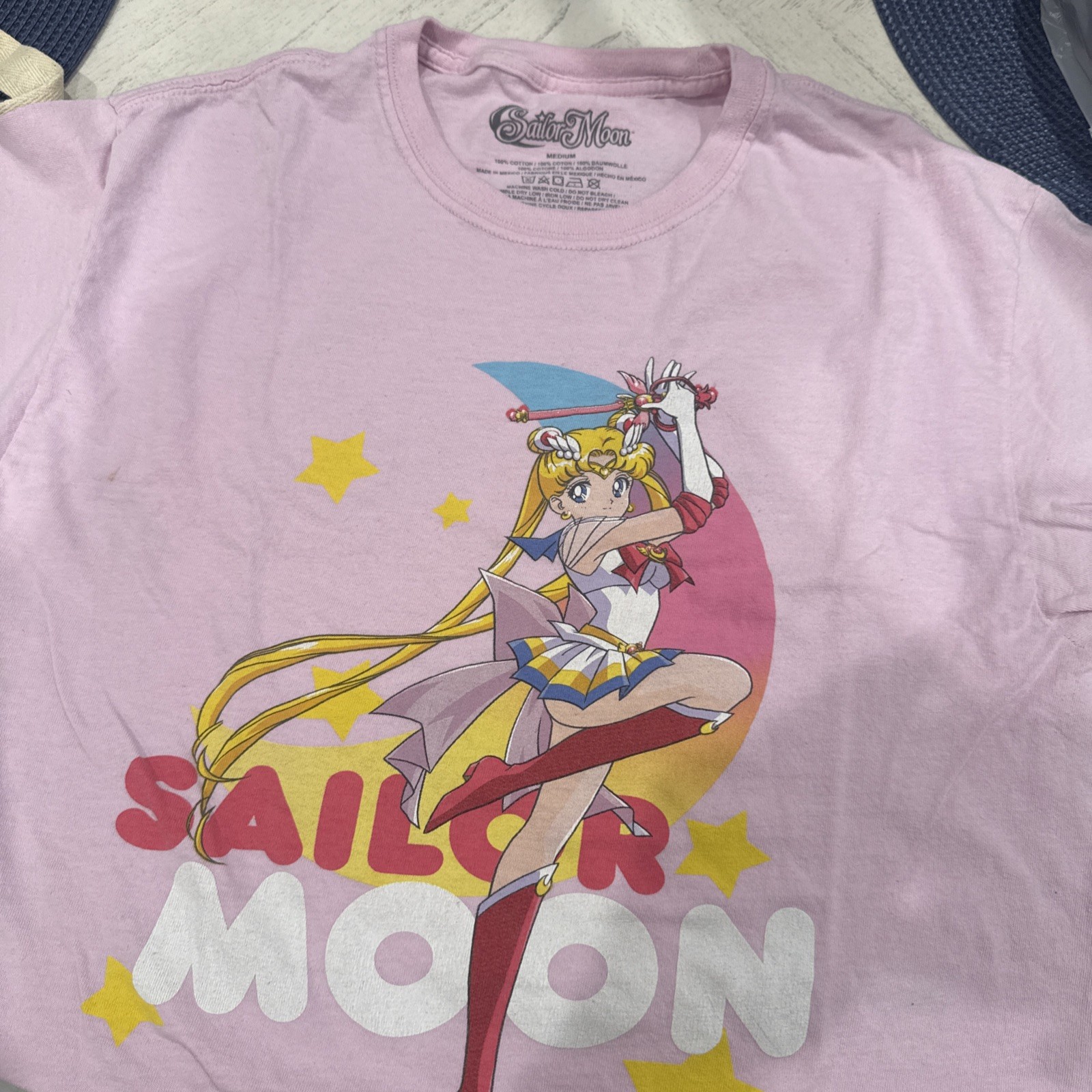 Sailor Moon Adult New T-Shirt – One Legged Pose Arms Up Over Logo