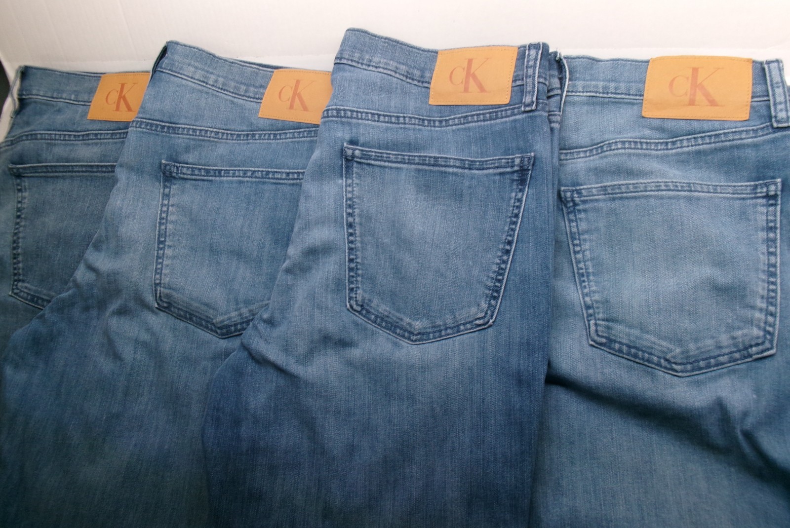 Calvin Klein Straight Leg Jeans sits below waist easy fit hip &thigh Medium Wash
