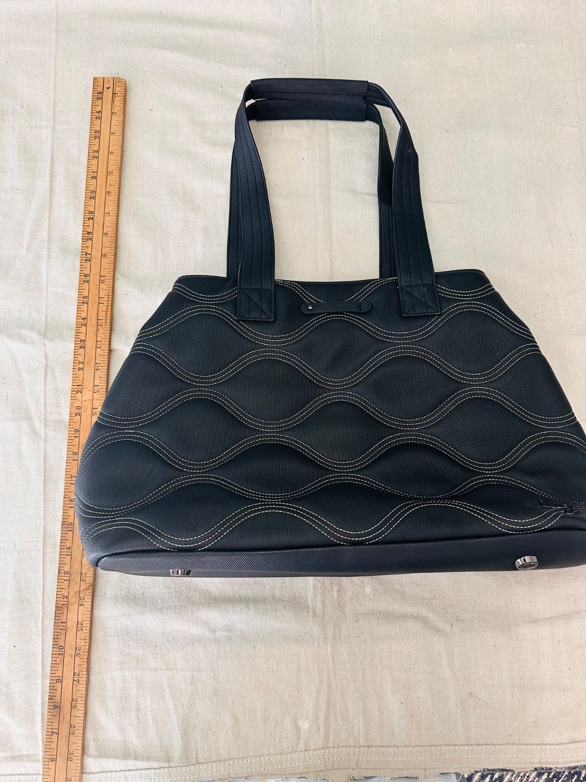 black lug handbag multicolored wavy stitching. Multi functional / very spacious