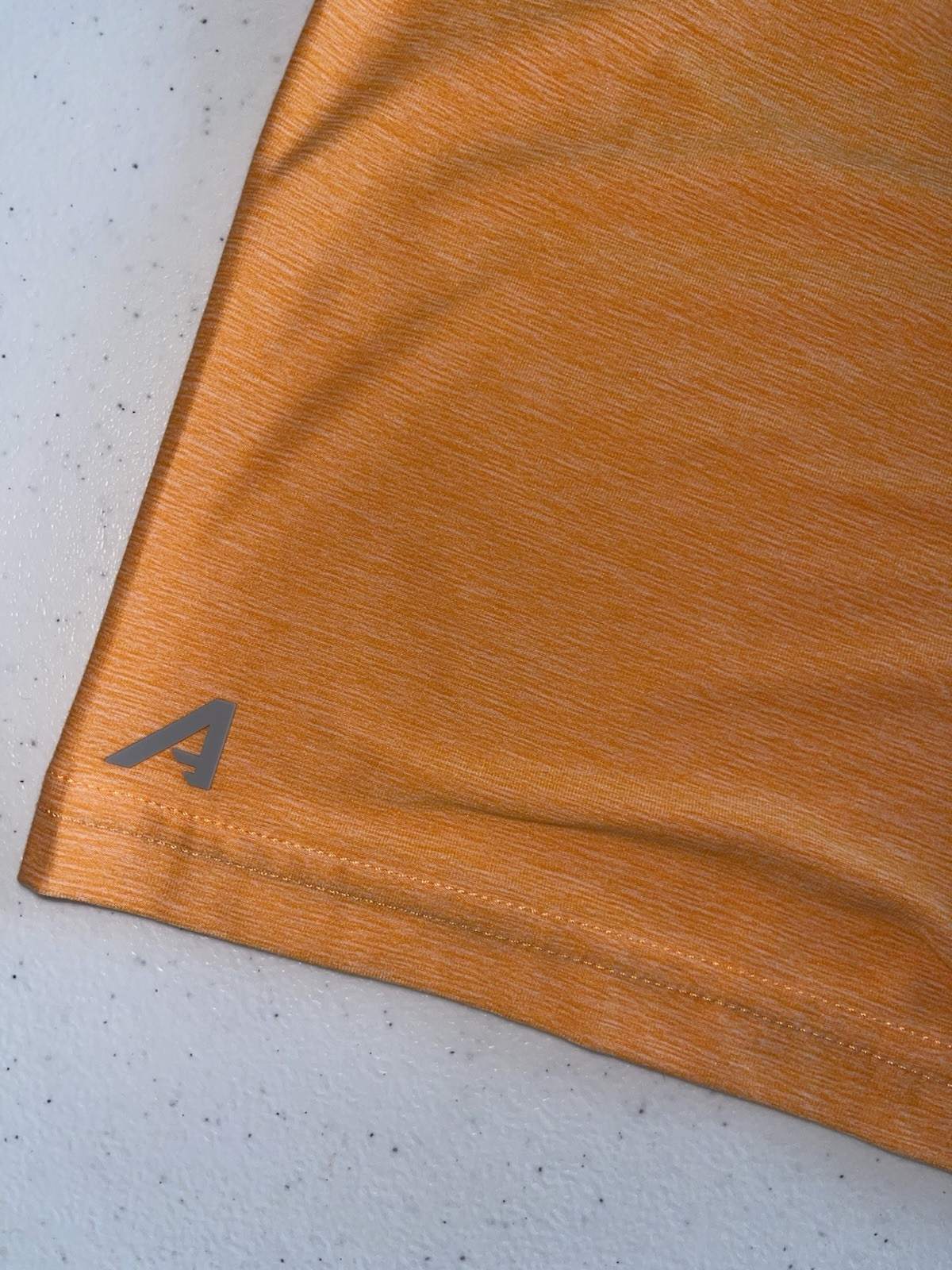 Antigua Men’s Orange Heather Polo with Embroidered Team Crest