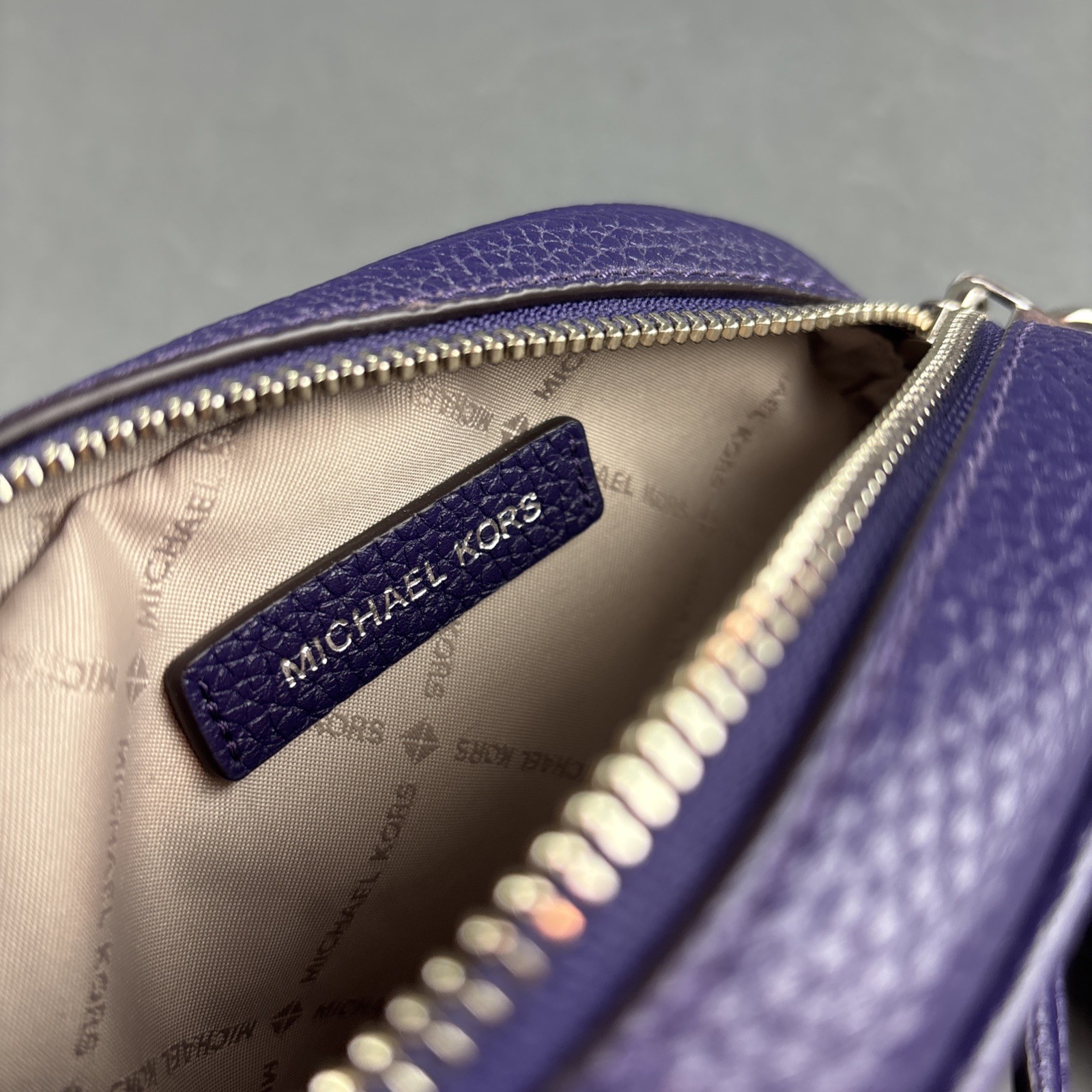 Michael Kors Purple Pebbled Leather Small Oval 7.75″x5.5″ Crossbody Bag w/Tassel