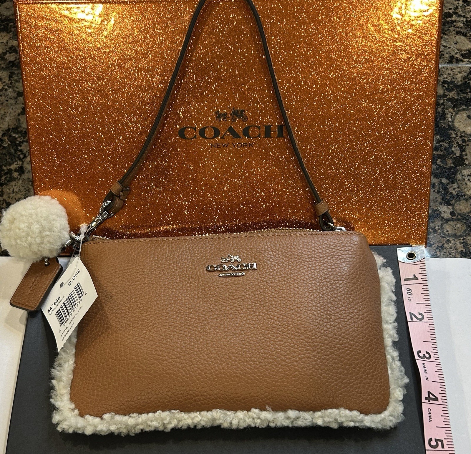 Coach Brown Pebbled Wristlet Pouch Shearling Trim Zip Wrist Strap Pompom Charm