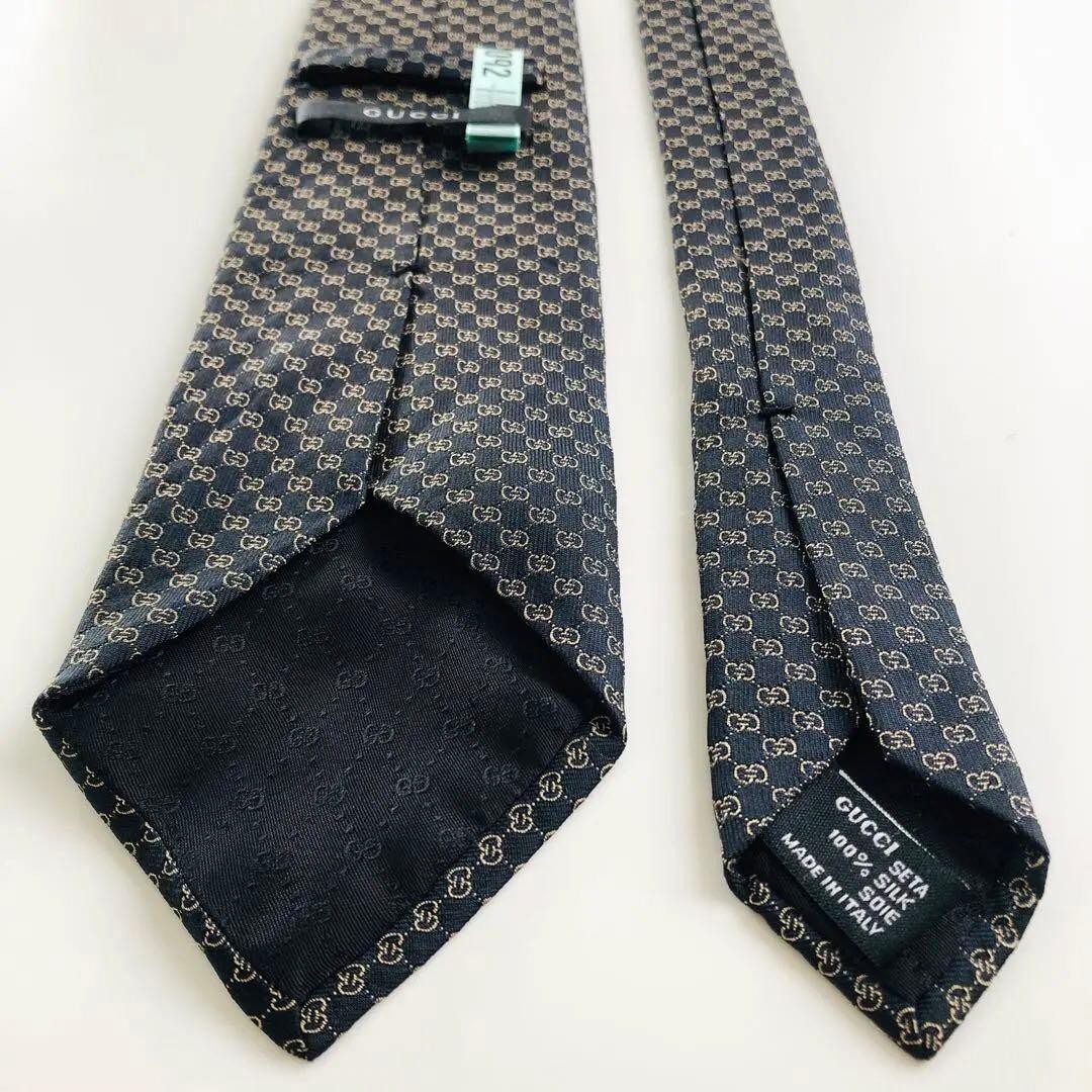 GUCCI Emblem Pattern Silk Tie Black Bronze 8.3cm Wide 154cm Long Pre-owned