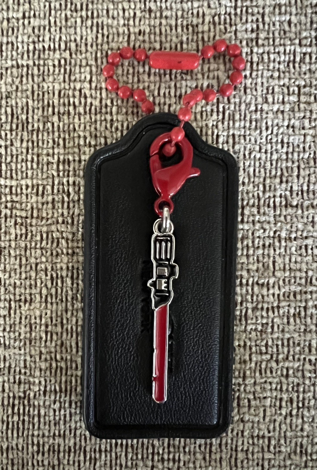 Coach Large 2.25” Black HangTag Star Wars Sith / Jedi Red Light Saber Charm New