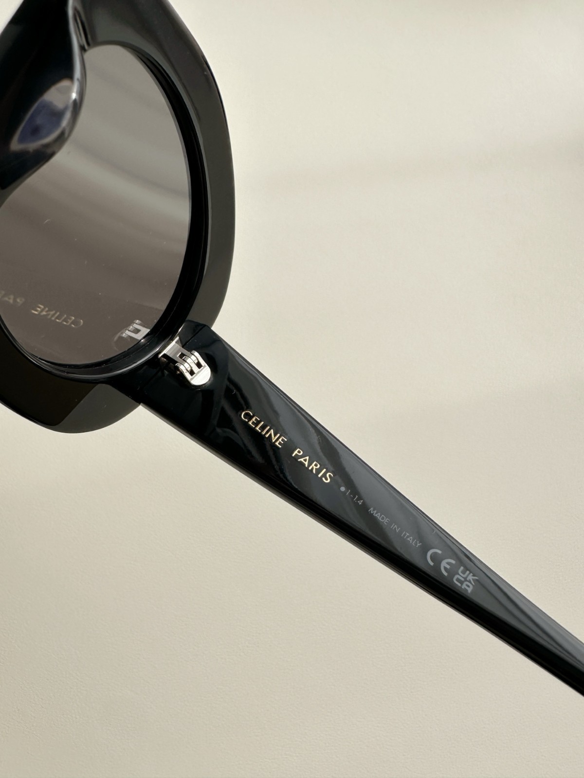 CELINE Iconic Triomphe Oval Sunglasses Black Frame Gold Logo Detail