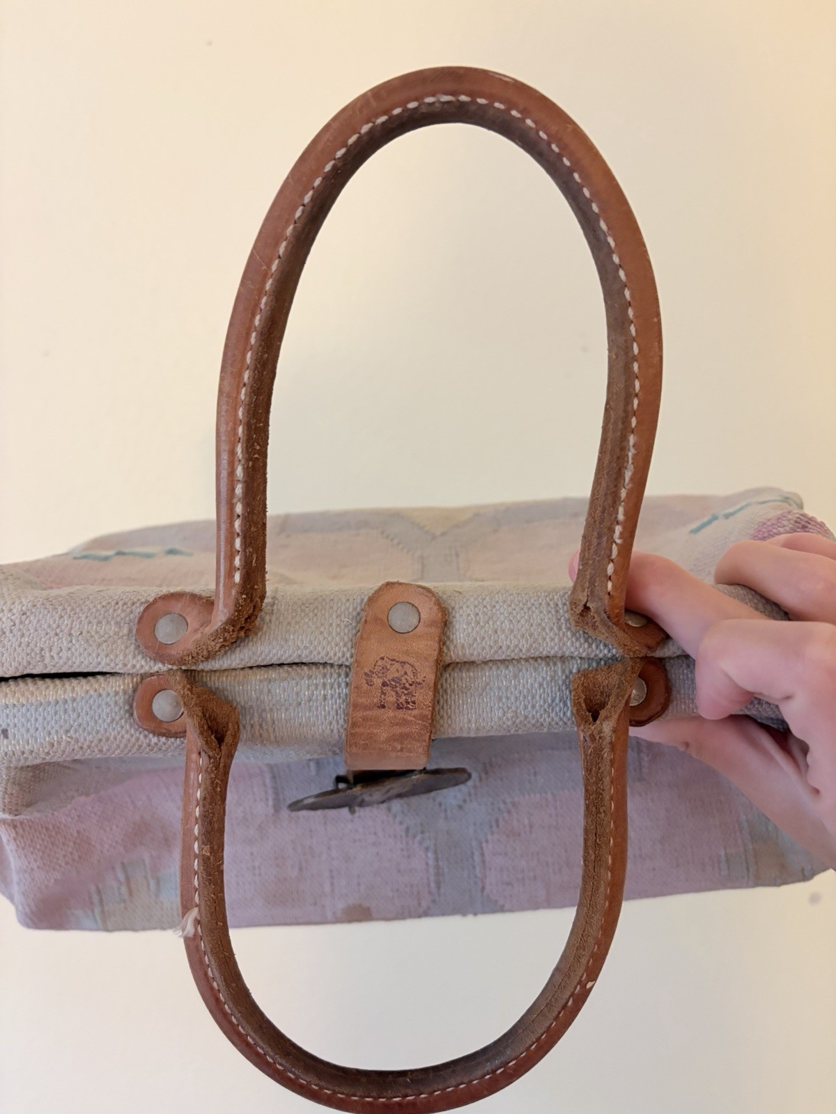 Vintage The Elephant Walk handbag with leather straps and metal elephant clasp