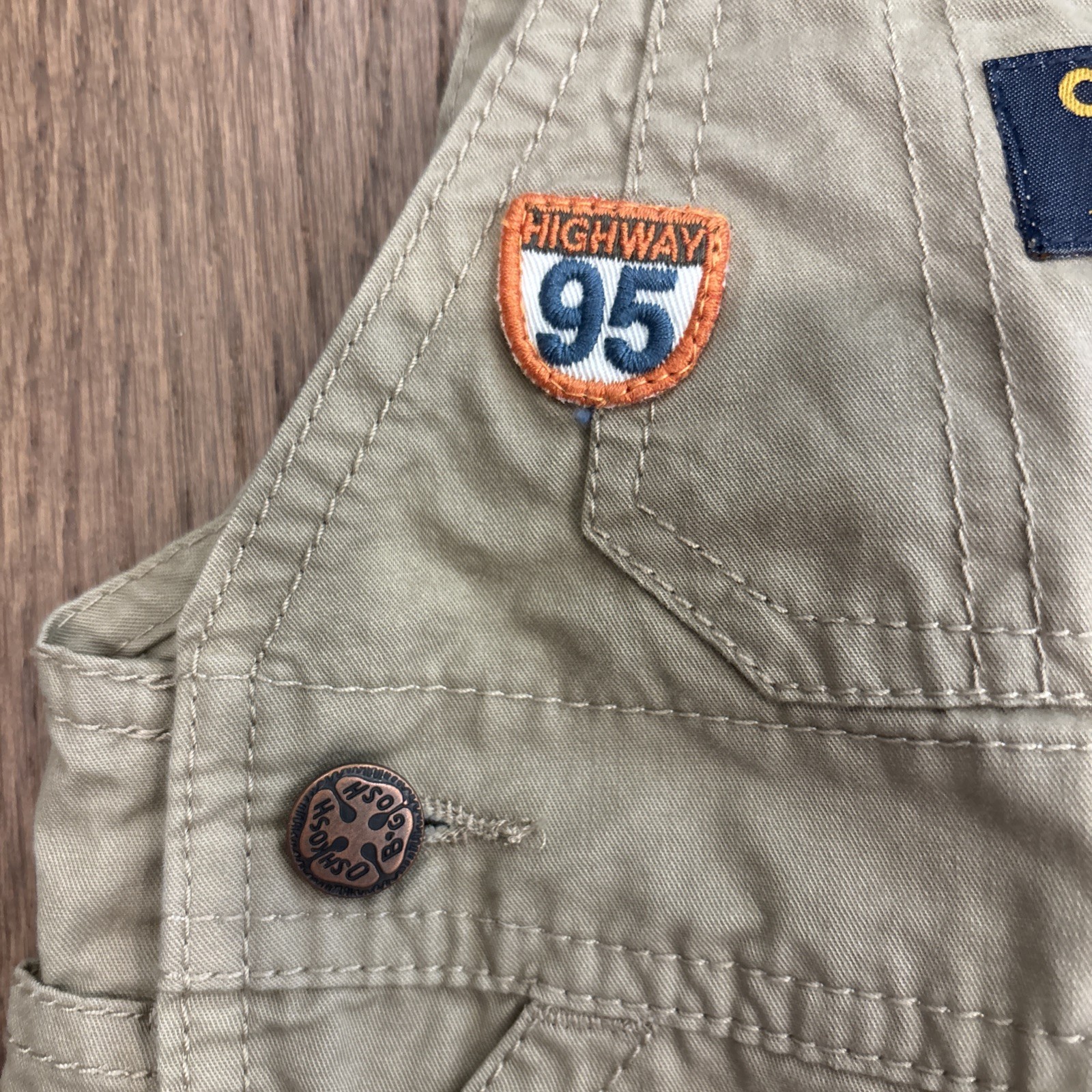 OshKosh B’Gosh Khaki Shorts Overalls W/ Highway 95 & Racer Car Size 3 Month