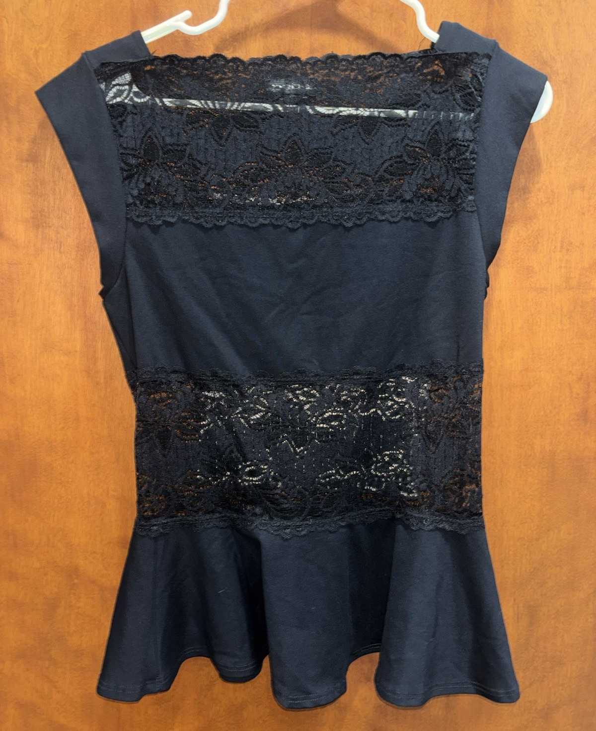 bebe Women’s Black Sleeveless Peplum Top Scoop Neck Lace Panels Pullover S