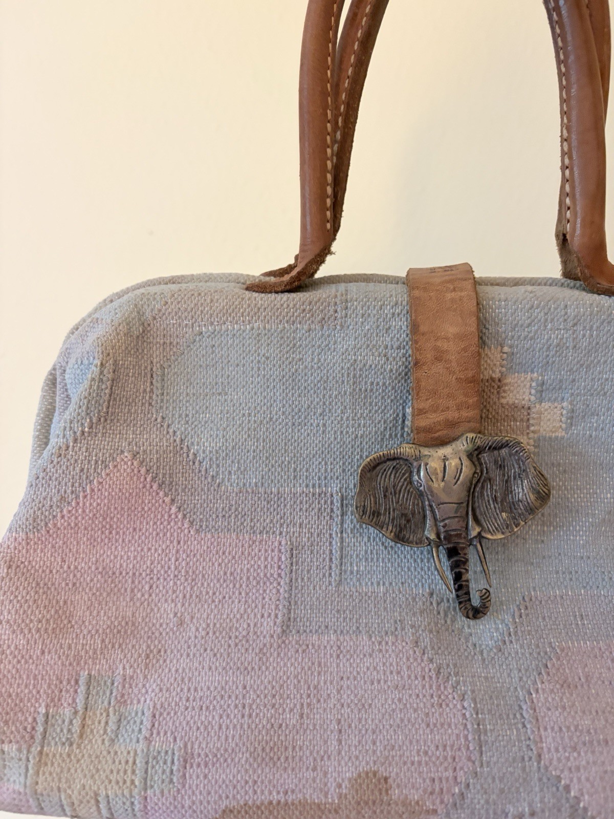 Vintage The Elephant Walk handbag with leather straps and metal elephant clasp