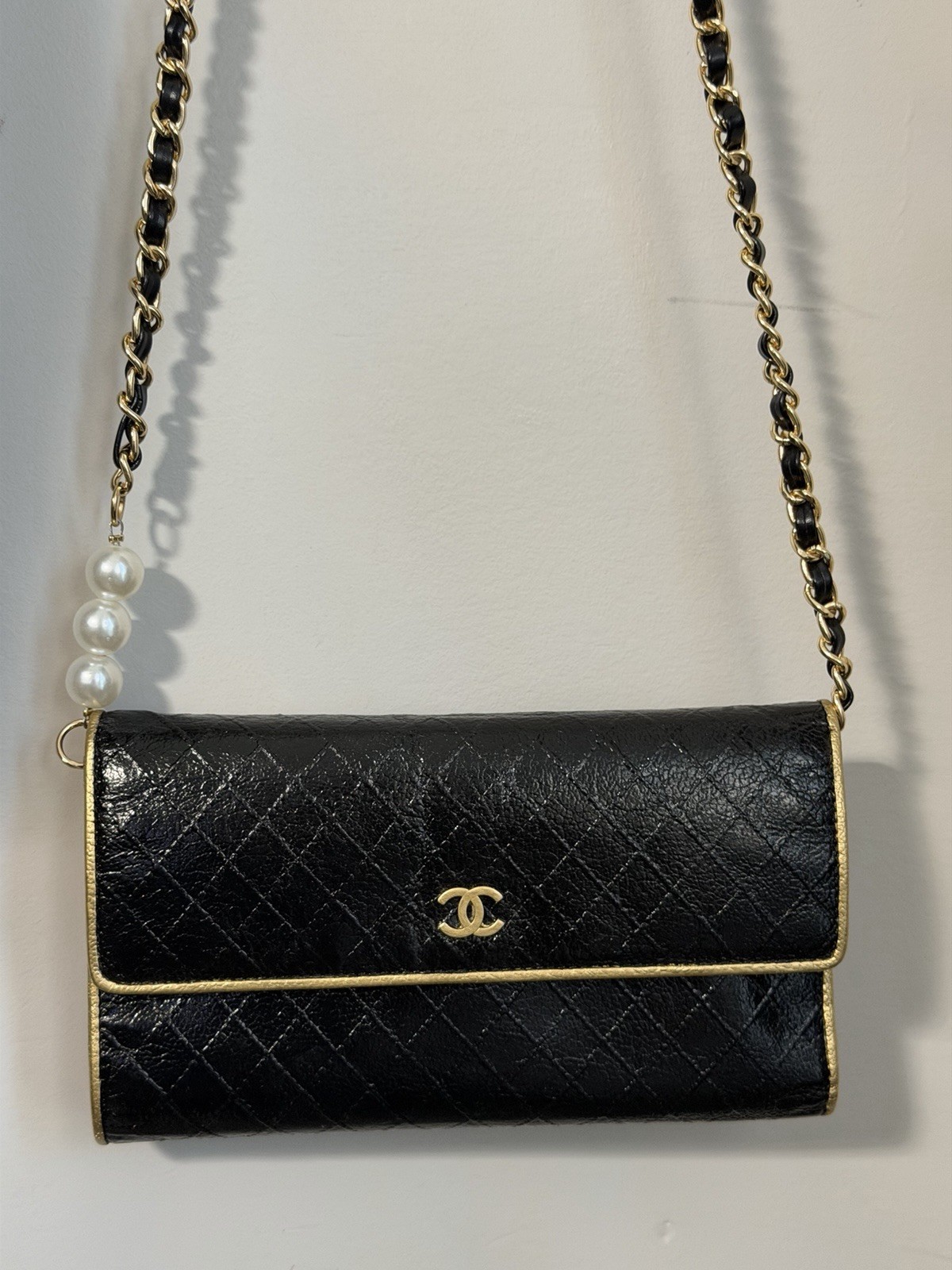 CHANEL Black Quilted Flap WOC Gold Hardware Chain Strap Pearl Accents