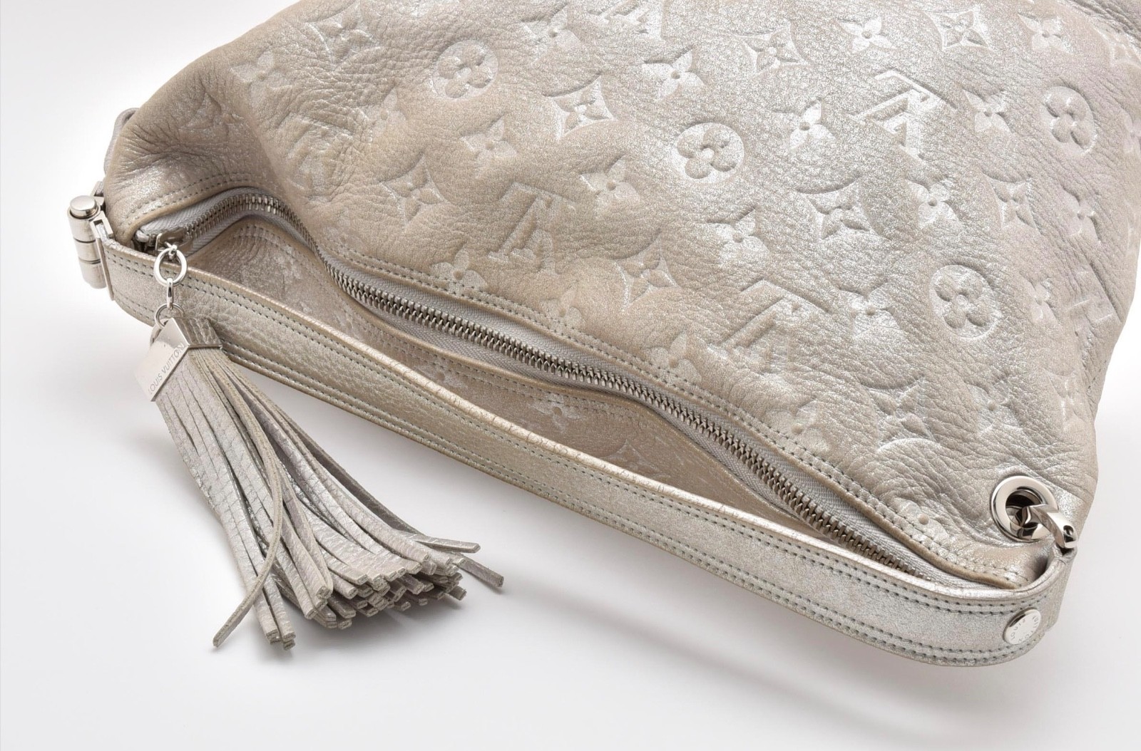 LOUIS VUITTON Shimmer Halo Silver Monogram Embossed Leather Hand Bag