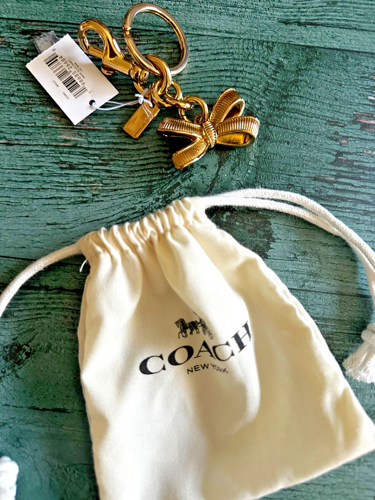NWT Coach CEM83 Bow Bag Charm Gold/Gold CEM83 with Dust bag🎀