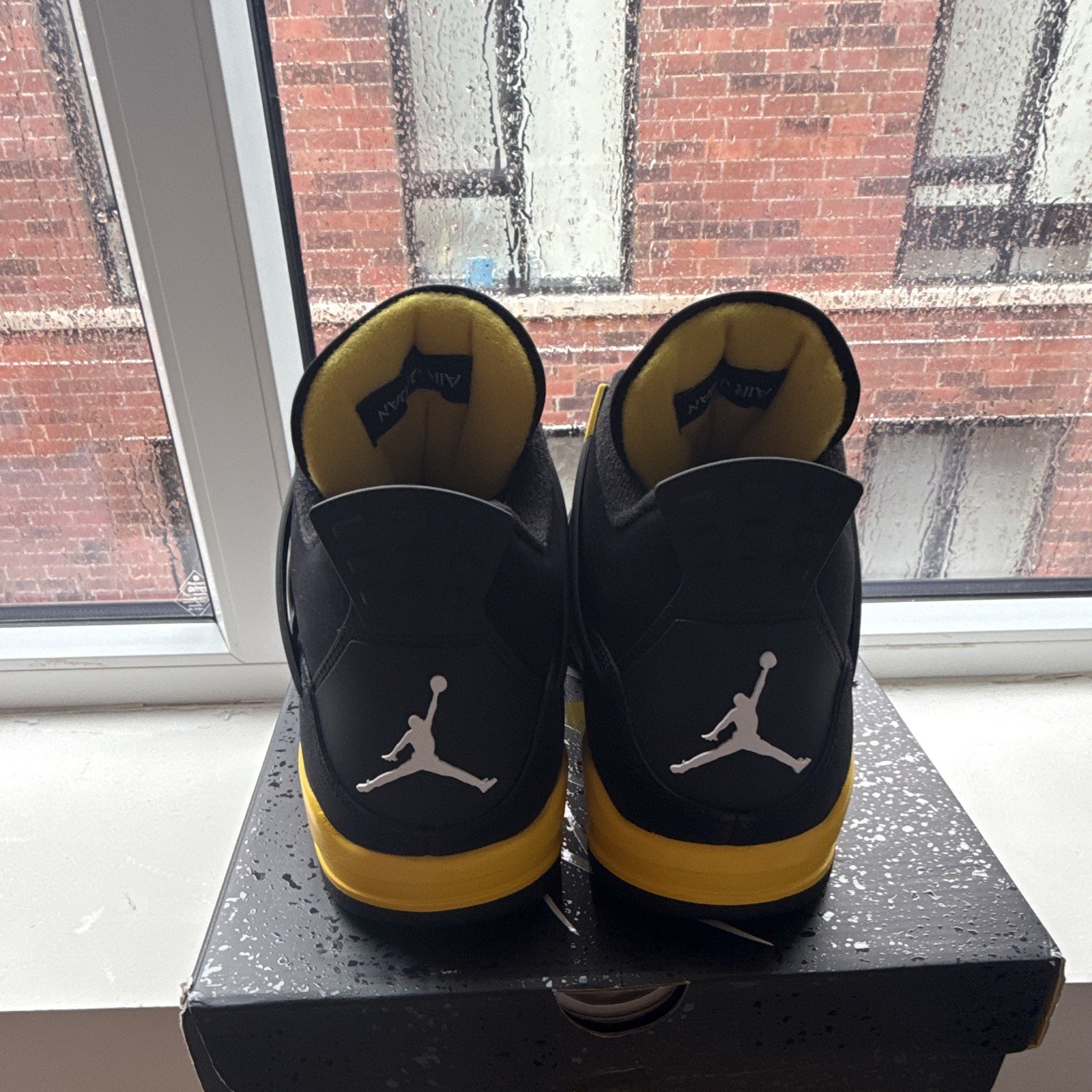 Jordan Air Jordan 4 Retro Thunder Mid Top Sneaker Black/Tour Yellow 2023