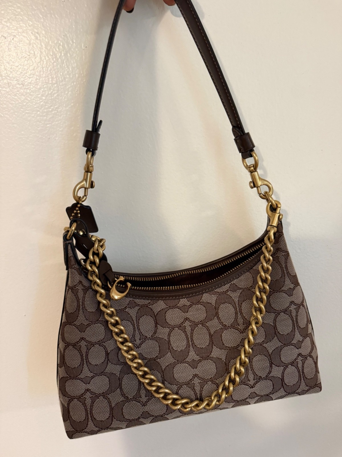 Brown and tan coach bag gently used. With brown stitching and gold hardware.