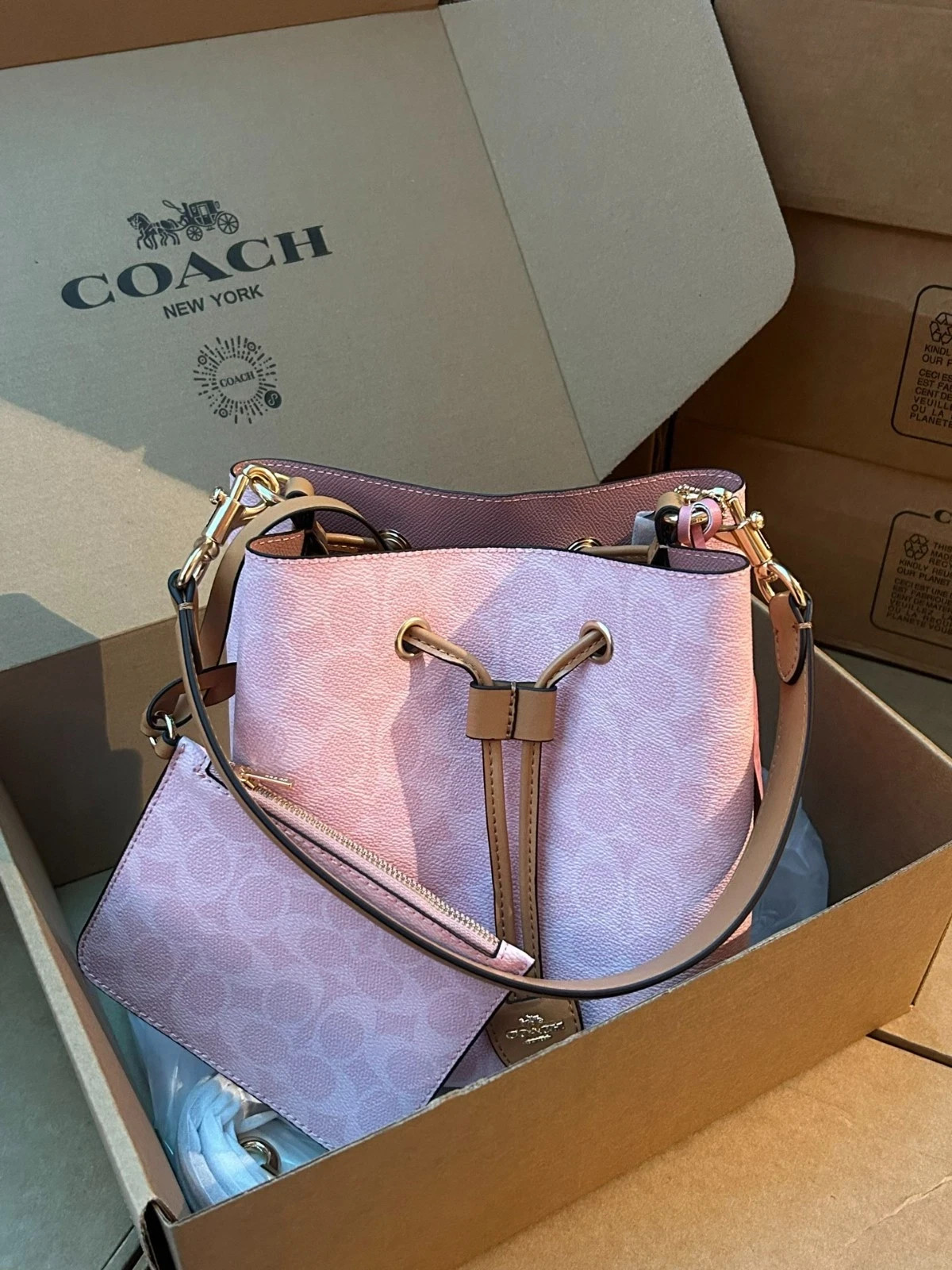 Coach CEA23 Rowan Bucket Bag In Signature Canvas With Charms Powder Pink