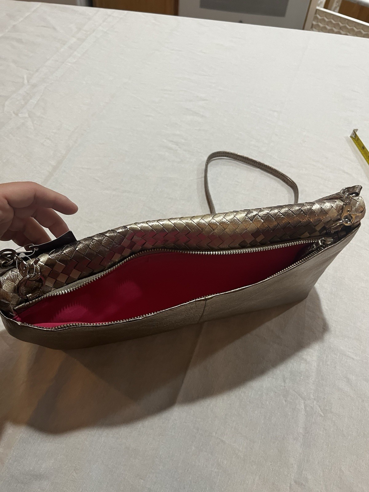 Elliott Lucca metallic woven leather convertible clutch/crossbody bag.