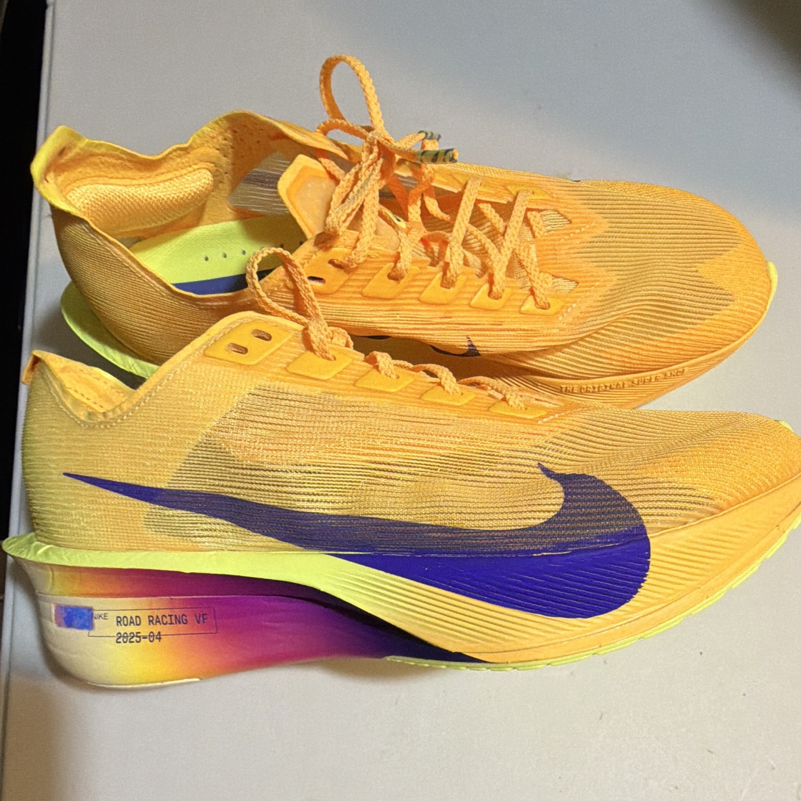 . Nike women’s Orange/Purple/Yellow Low Top Lace-Up Athletic Sneakers
