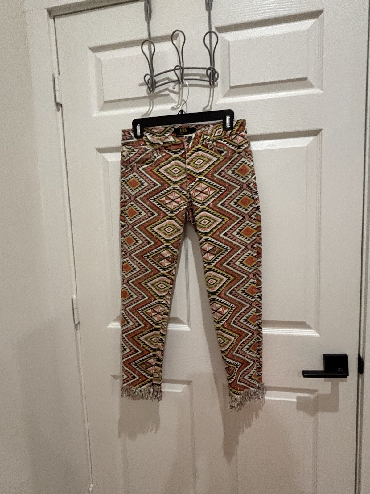 womans Lucky & Blessed size 8 mid rise ankle skinny aztic raw hem pants