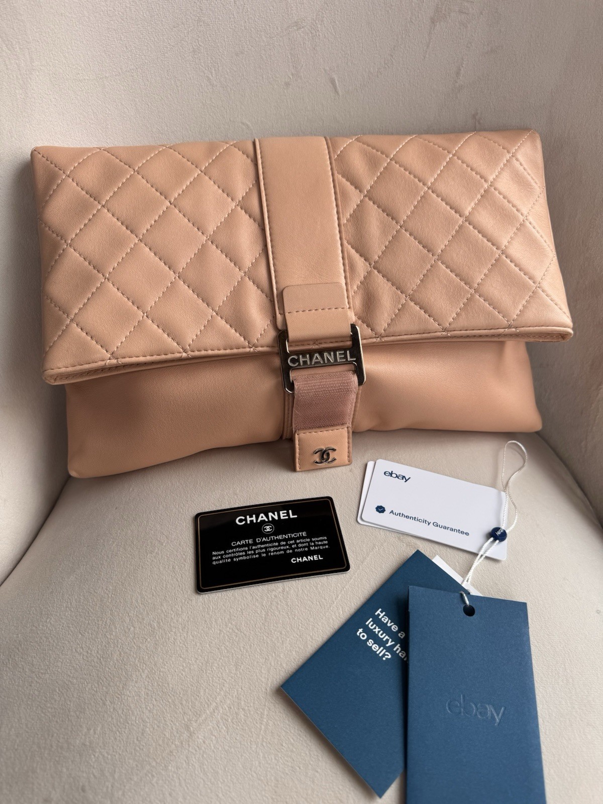 CHANEL Beige Quilted CC Logo Buckle Clutch Silver Hardware Inner Zipper