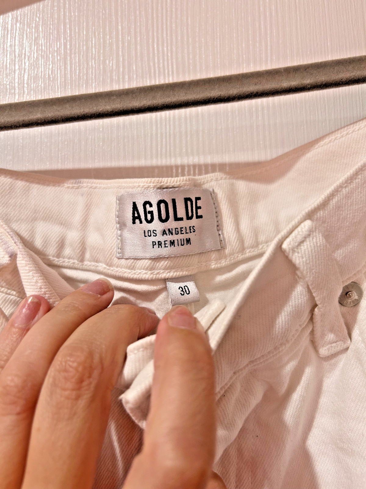 agolde pinch waist jeans in white. new with slight marks at waist. size 30