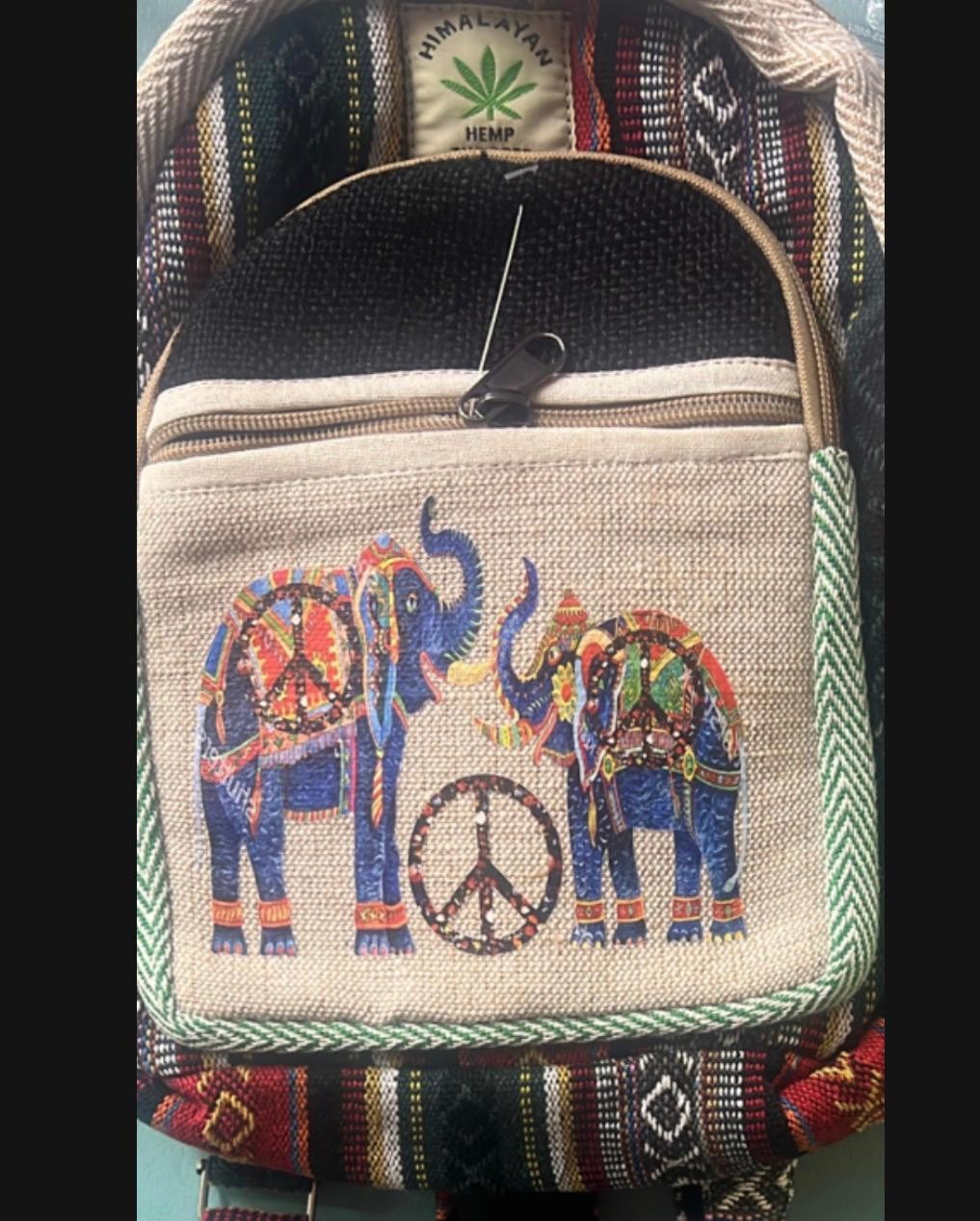 Himalayan Hemp backpack features vibrant, embroidered elephants and a peace sign