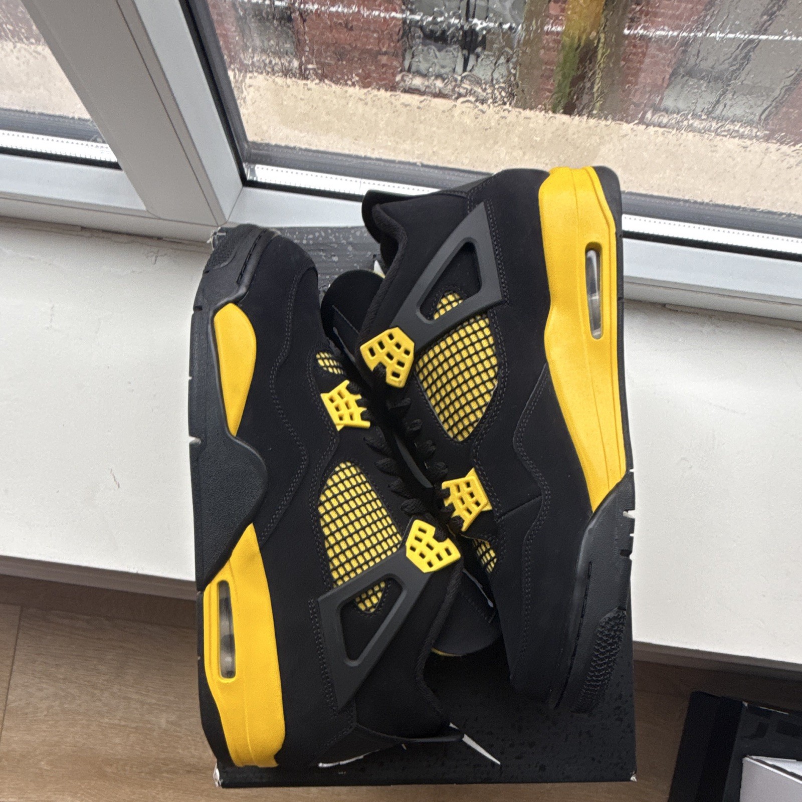 Jordan Air Jordan 4 Retro Thunder Mid Top Sneaker Black/Tour Yellow 2023