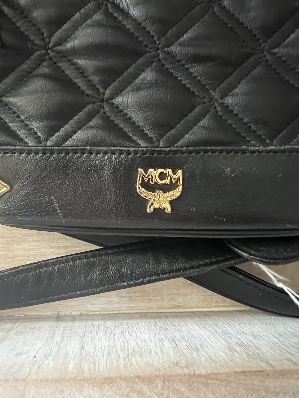 MCM Black Quilted Drawstring Bucket Shoulder Bag Tassel Logo Gold Hardware