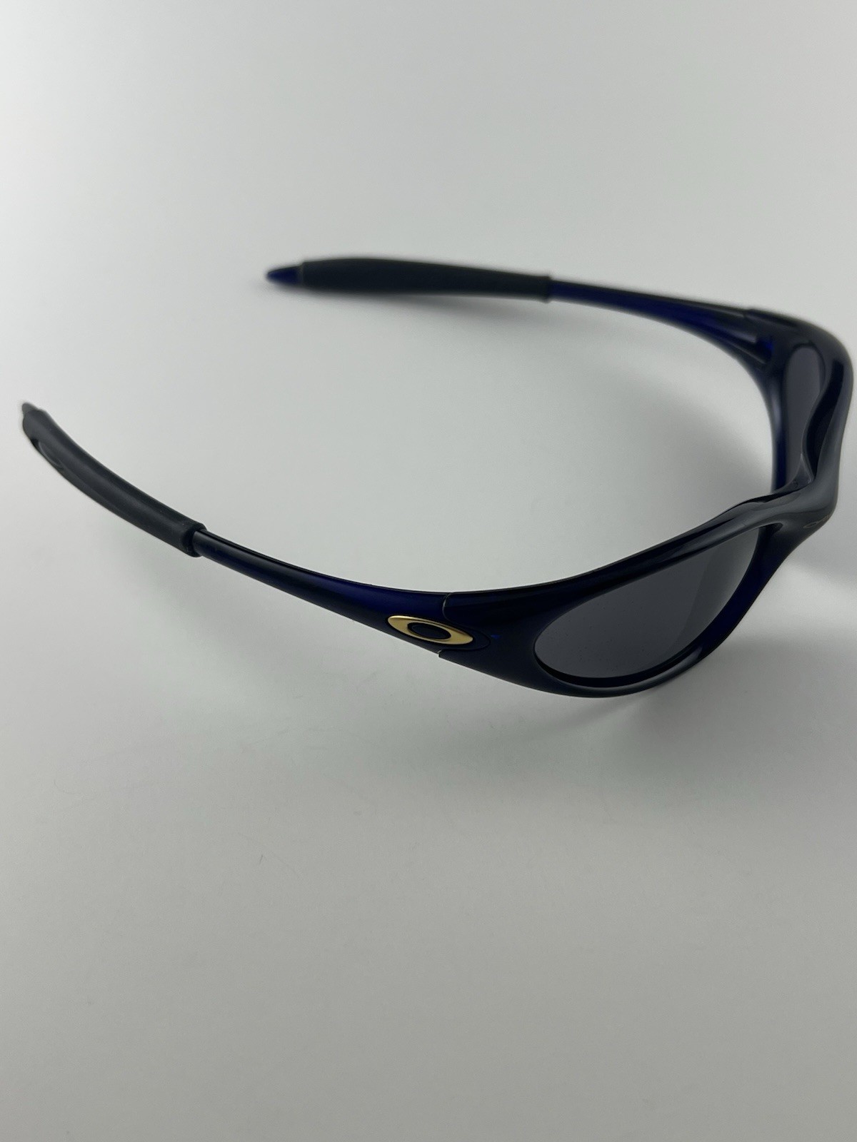 Oakley Minute 1.0 Crystal Blue Frame Black Iridium Lens Gold Icons XX RARE
