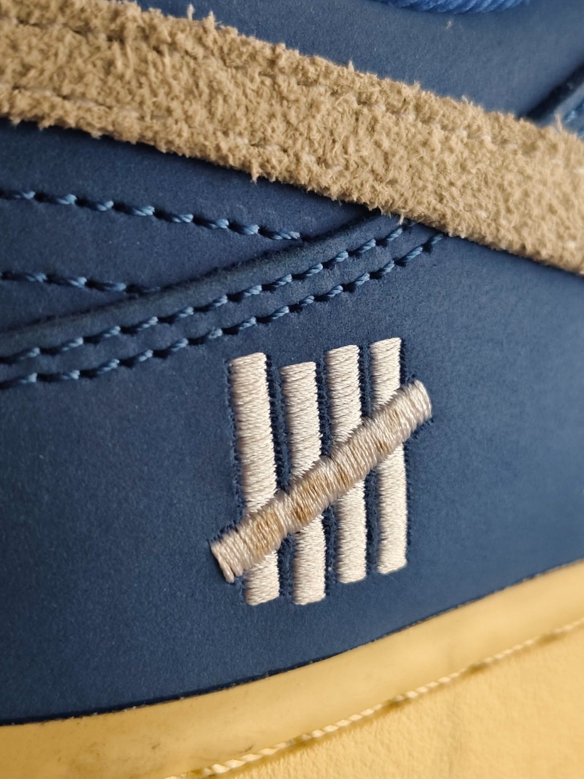UNDEFEATED’s “Dunk vs. AF-1” Collection Grows With This Snakeskin- Dunk Low
