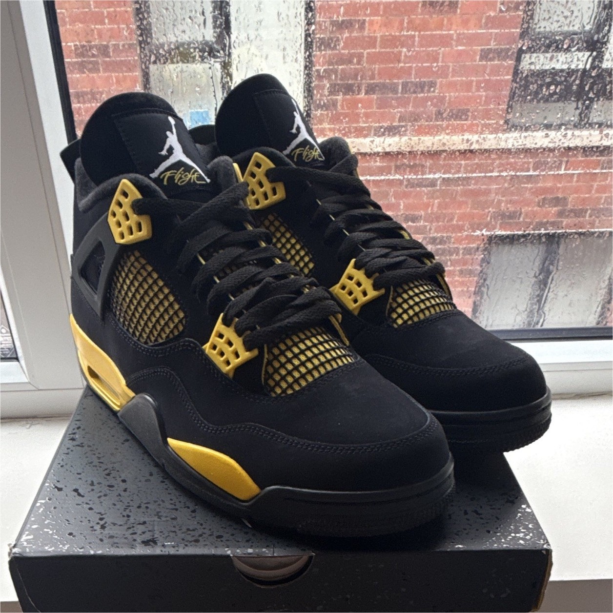 Jordan Air Jordan 4 Retro Thunder Mid Top Sneaker Black/Tour Yellow 2023