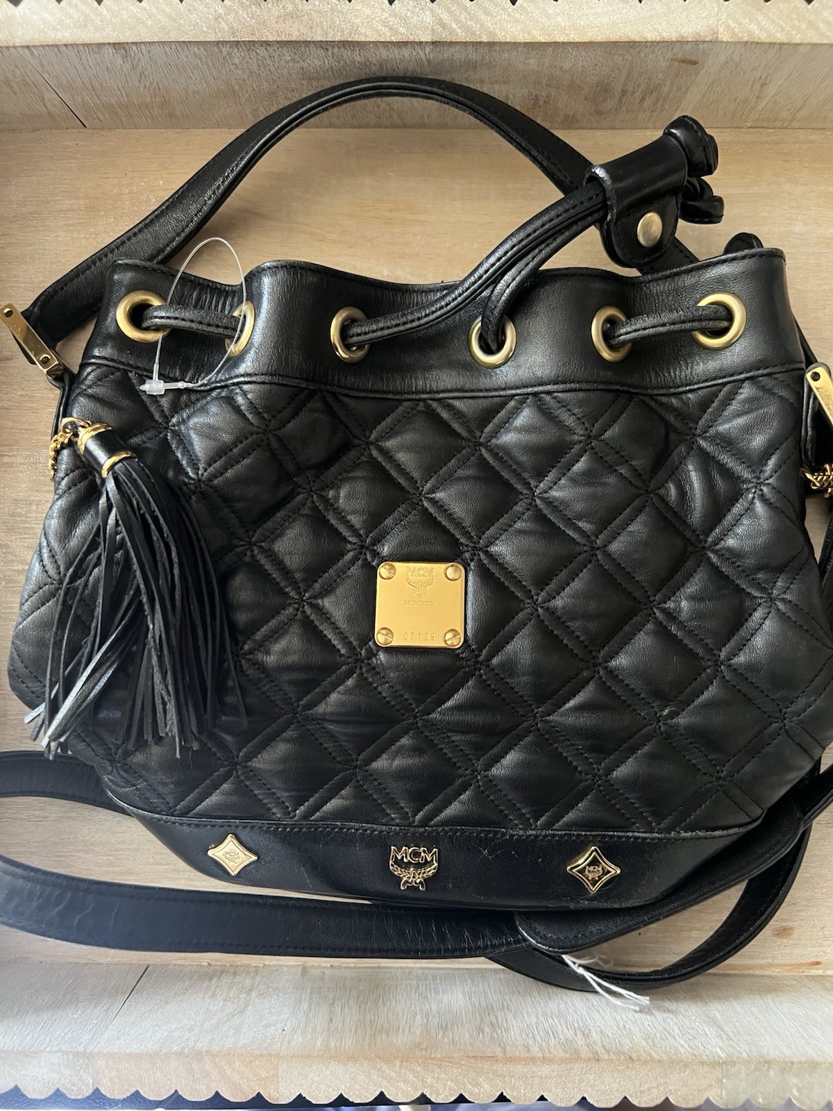 MCM Black Quilted Drawstring Bucket Shoulder Bag Tassel Logo Gold Hardware