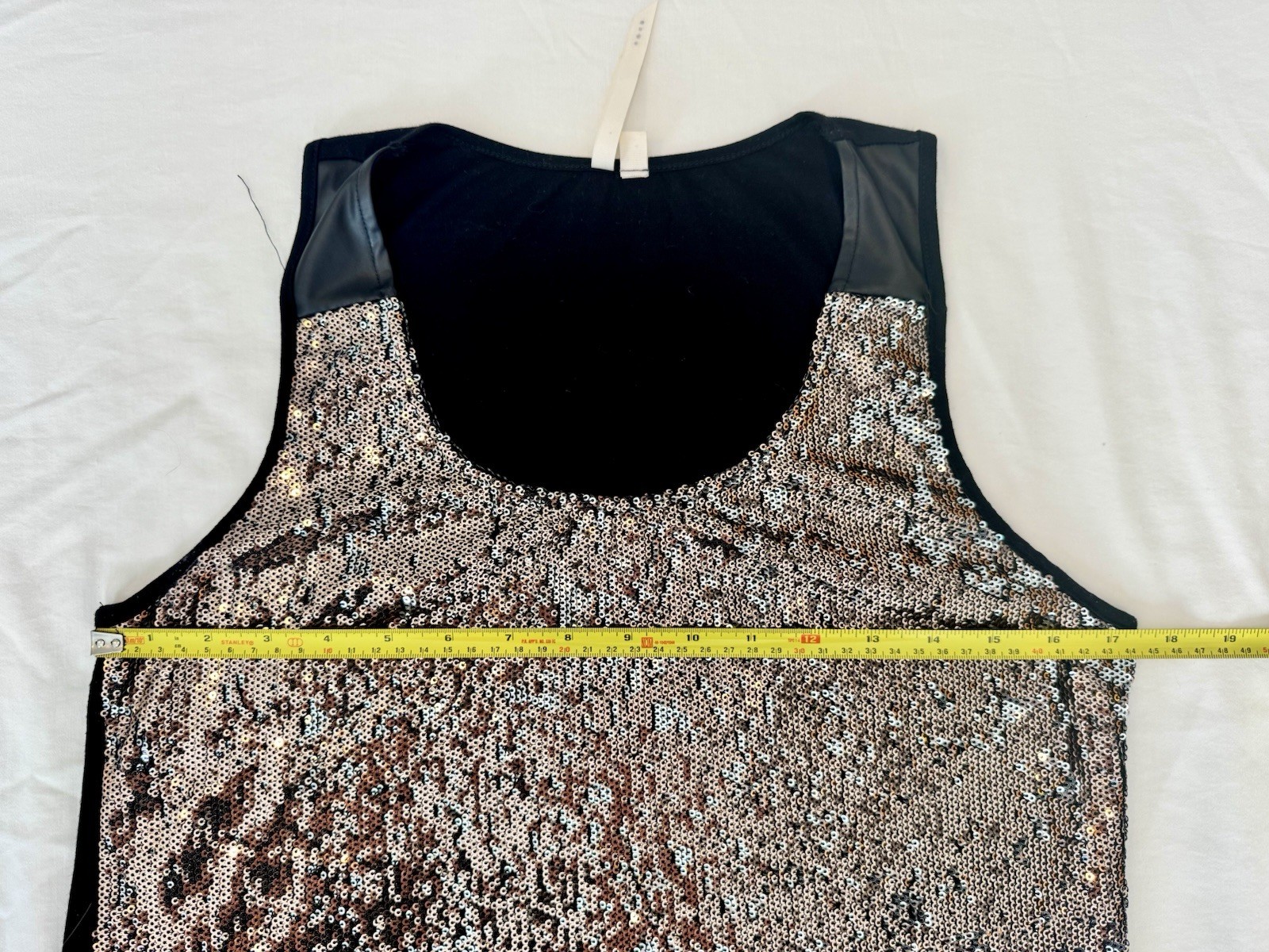 Bellatrix copper – silver sequined front with a contrasting solid black back.