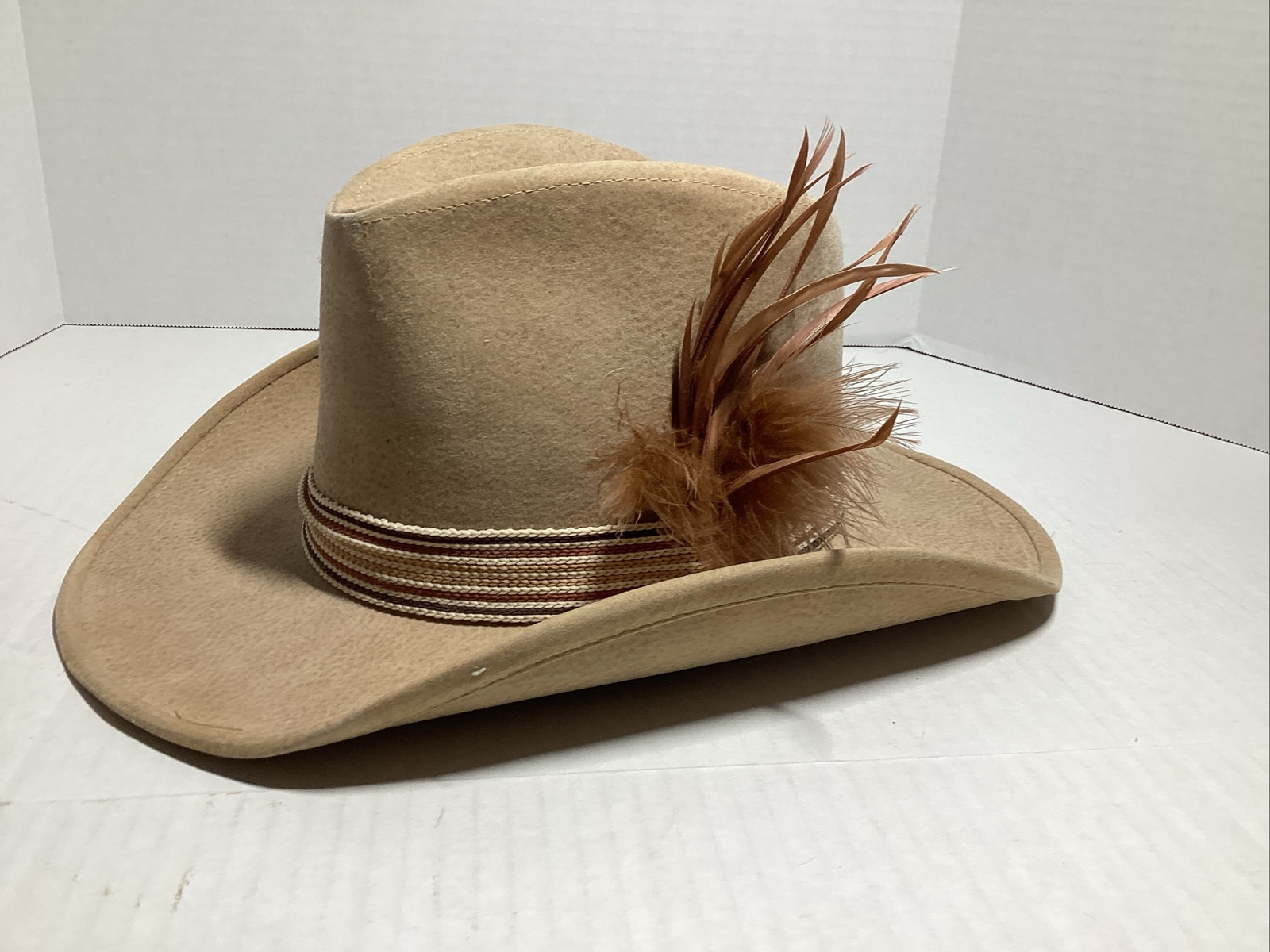 VTG Western Cowboy hat, Size Small, Head Measures 8 By 6 Inches, Tan, Feathers