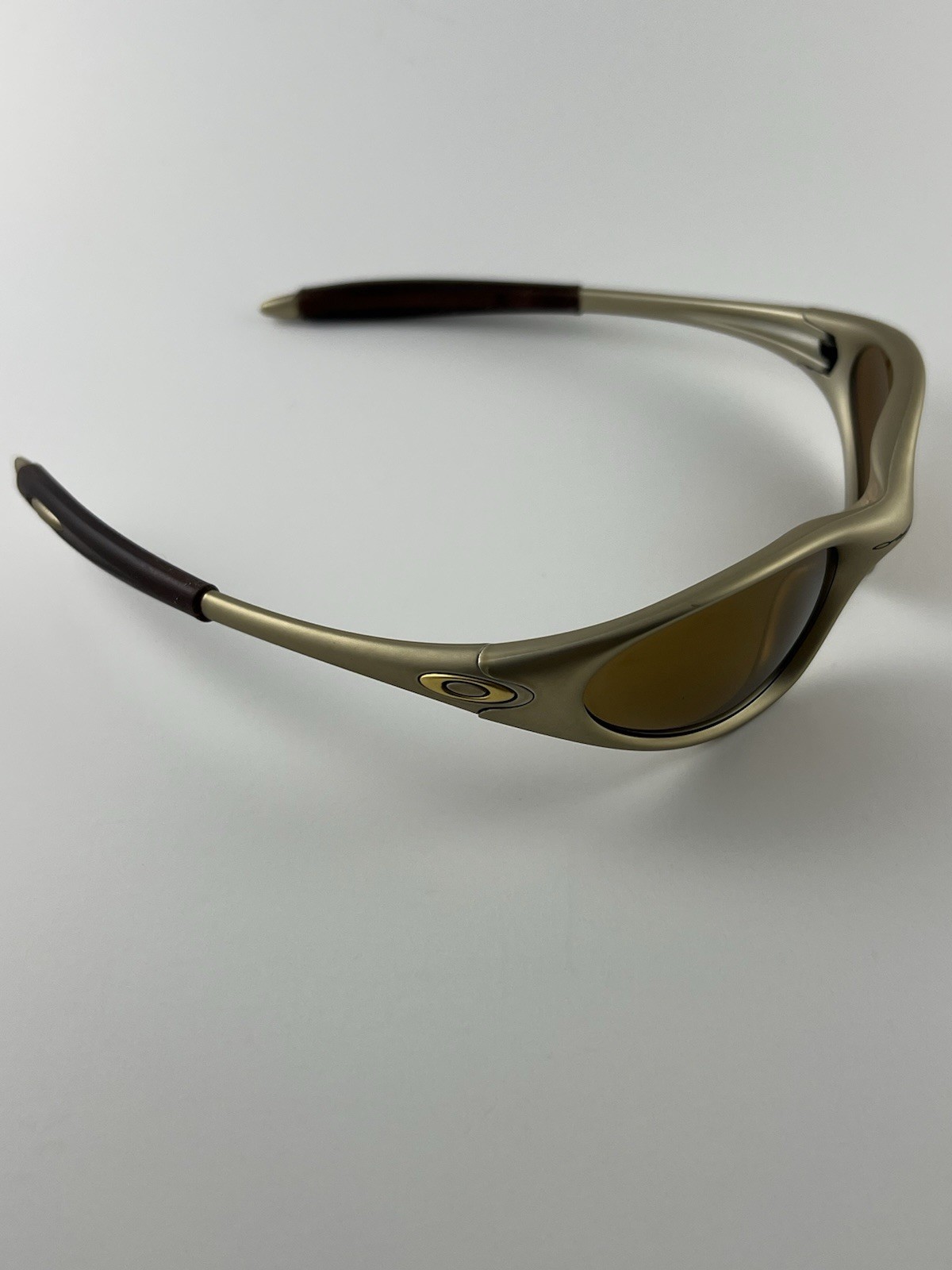 Oakley Minute 1.0 FMJ Platinum Frame Gold Iridium Lens Rootbeer Ear 04-082 XX