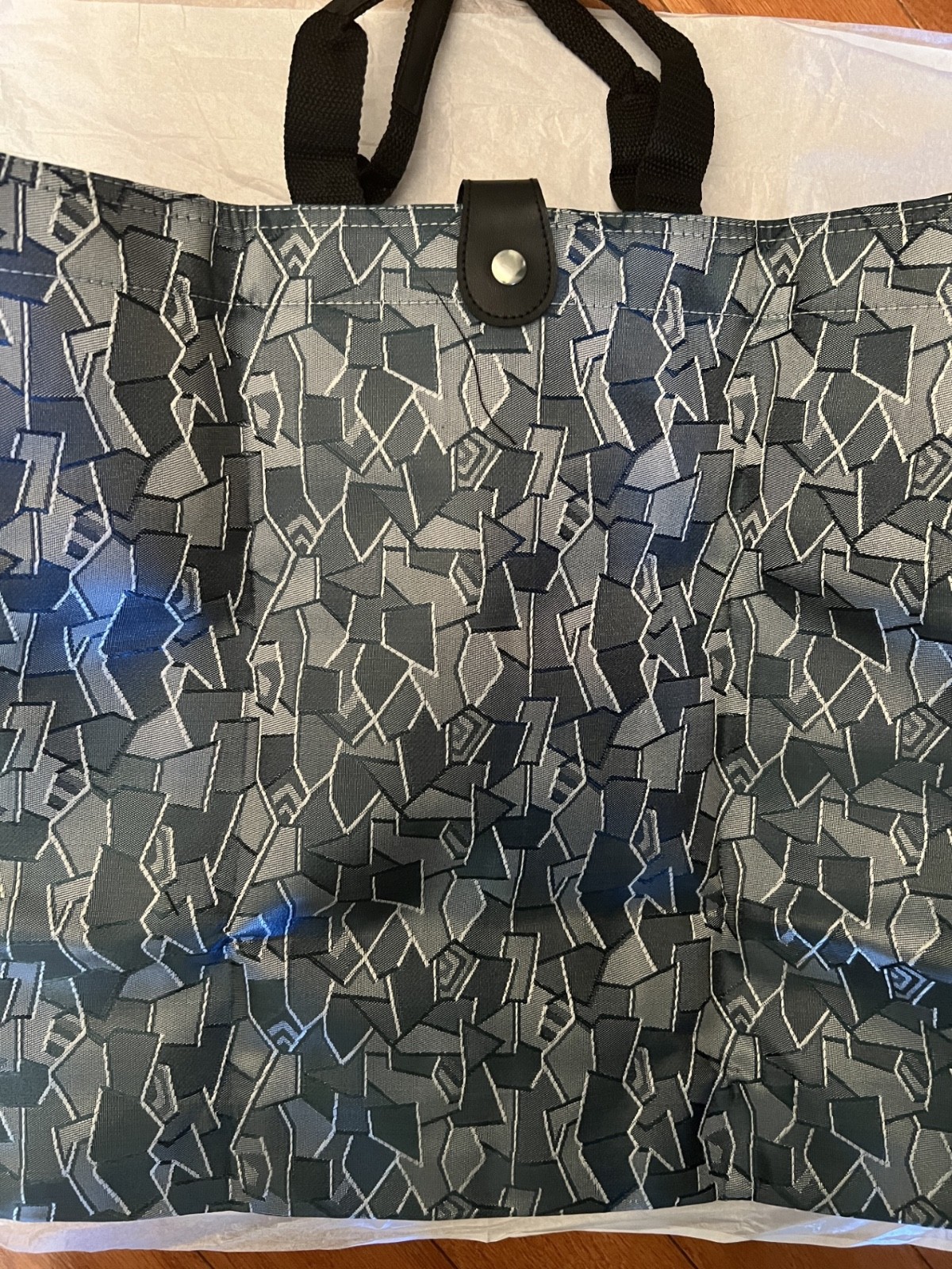 Denim Blue Fabric Folding Tote Bag w/ handles & snap closure. Size 15 X 15″.