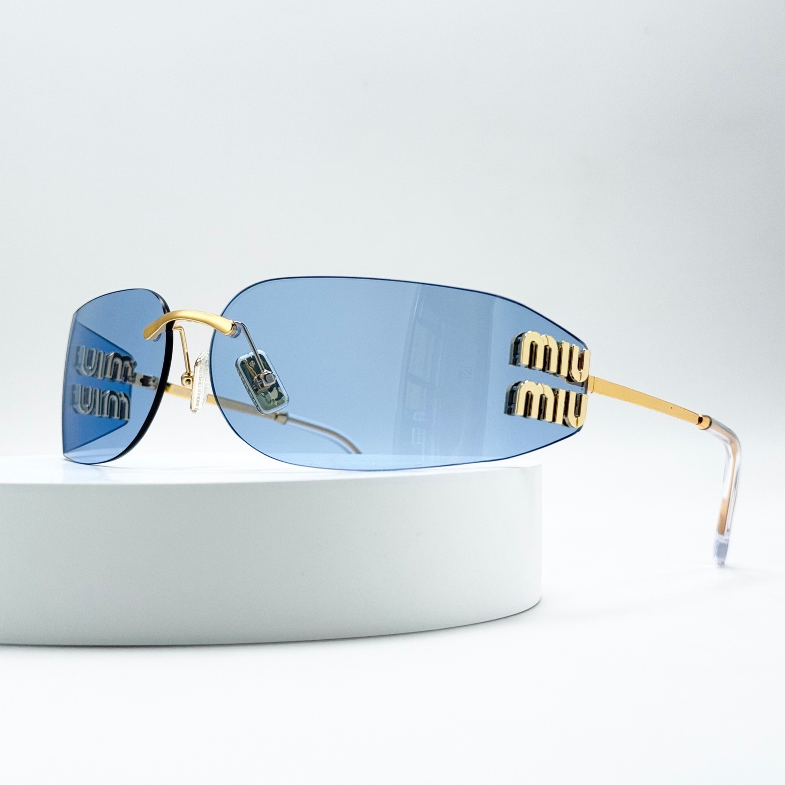 Miu Miu SMUA51 Wrap Sunglasses Pale Gold Frame Blue Lens Women 75-14-110