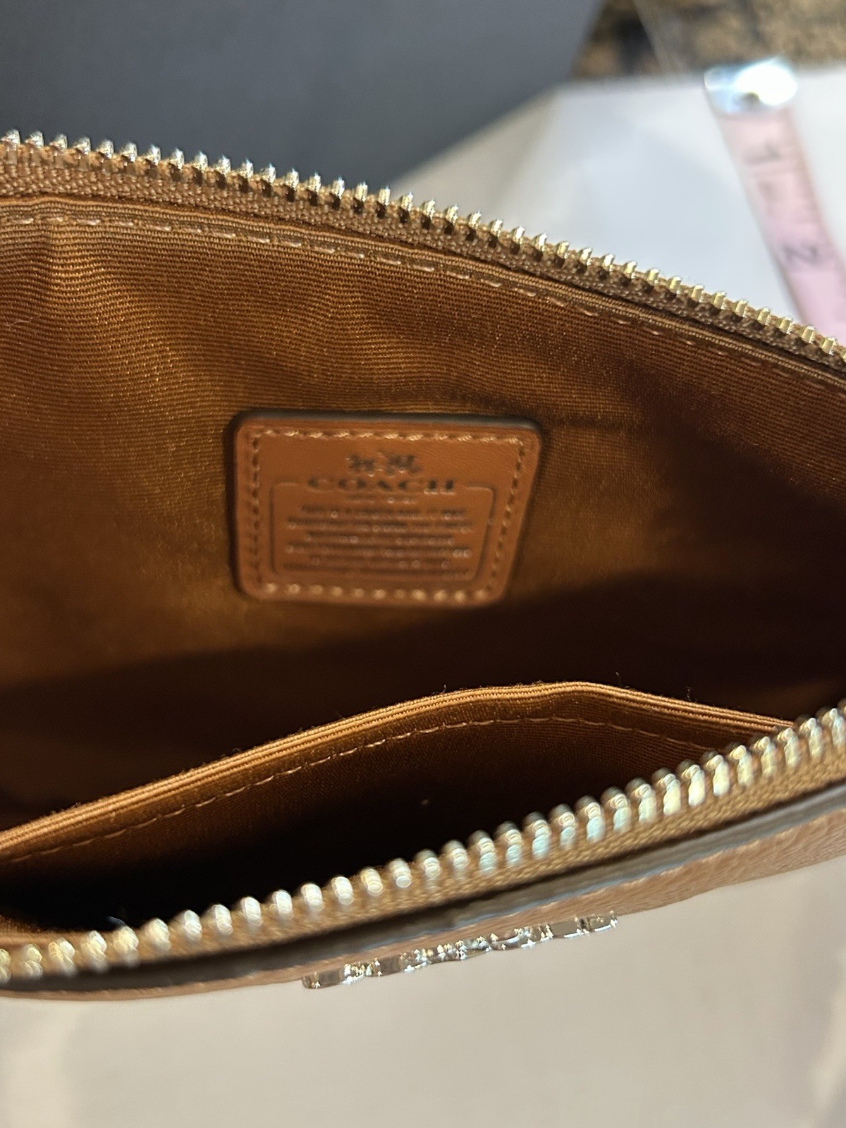 Coach Brown Pebbled Wristlet Pouch Shearling Trim Zip Wrist Strap Pompom Charm