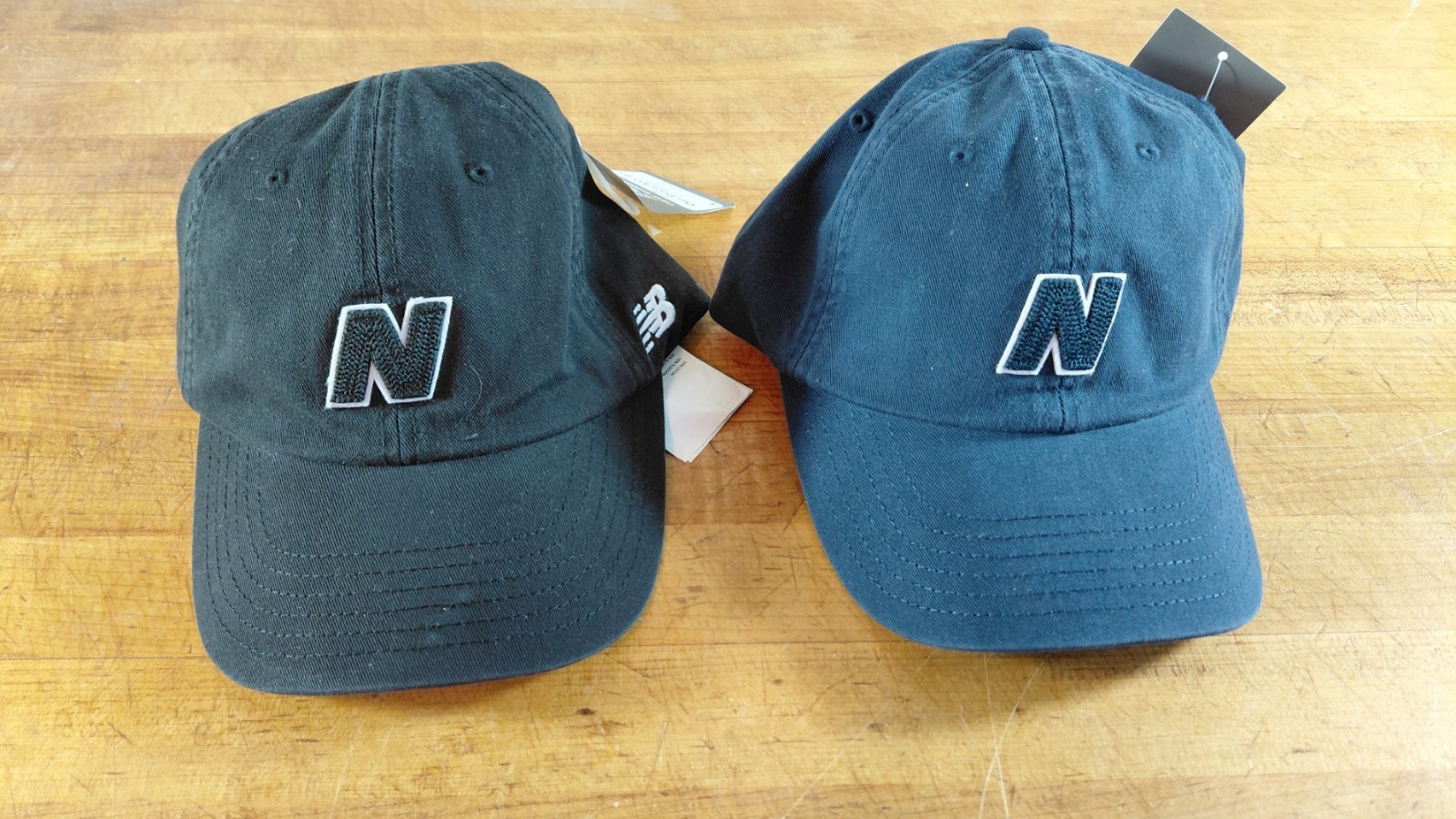 New Banance Ballcaps. Set of 2. 1 Black, 1 Blue. Adjustable Back. One Size.