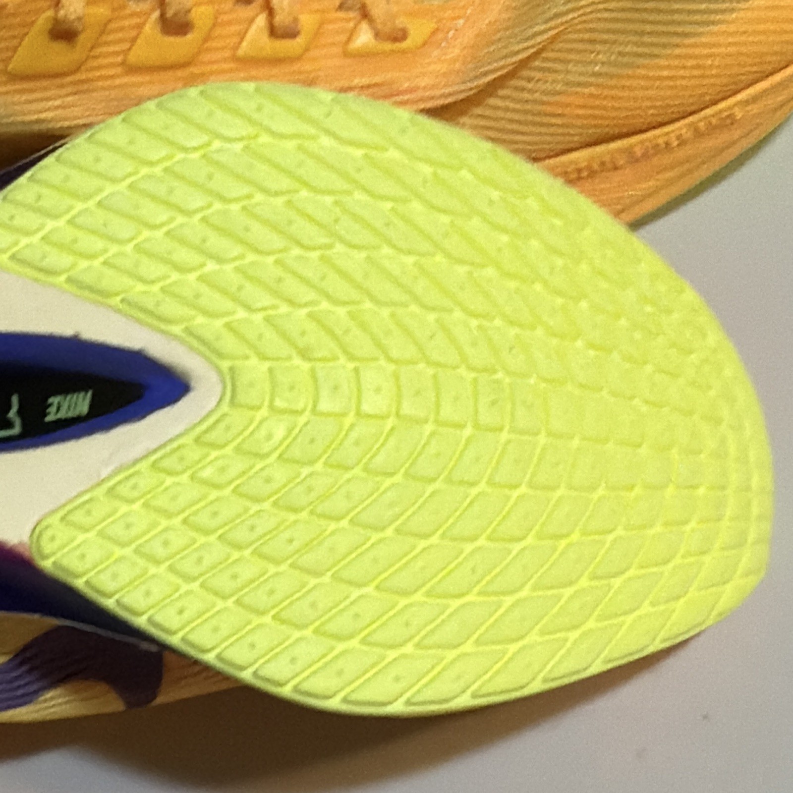 . Nike women’s Orange/Purple/Yellow Low Top Lace-Up Athletic Sneakers