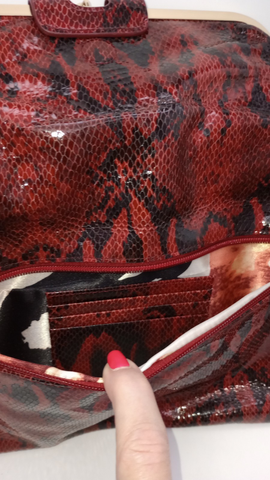 Elevate your style with this stunning Kate Landry Red Leather Clutch Purse.