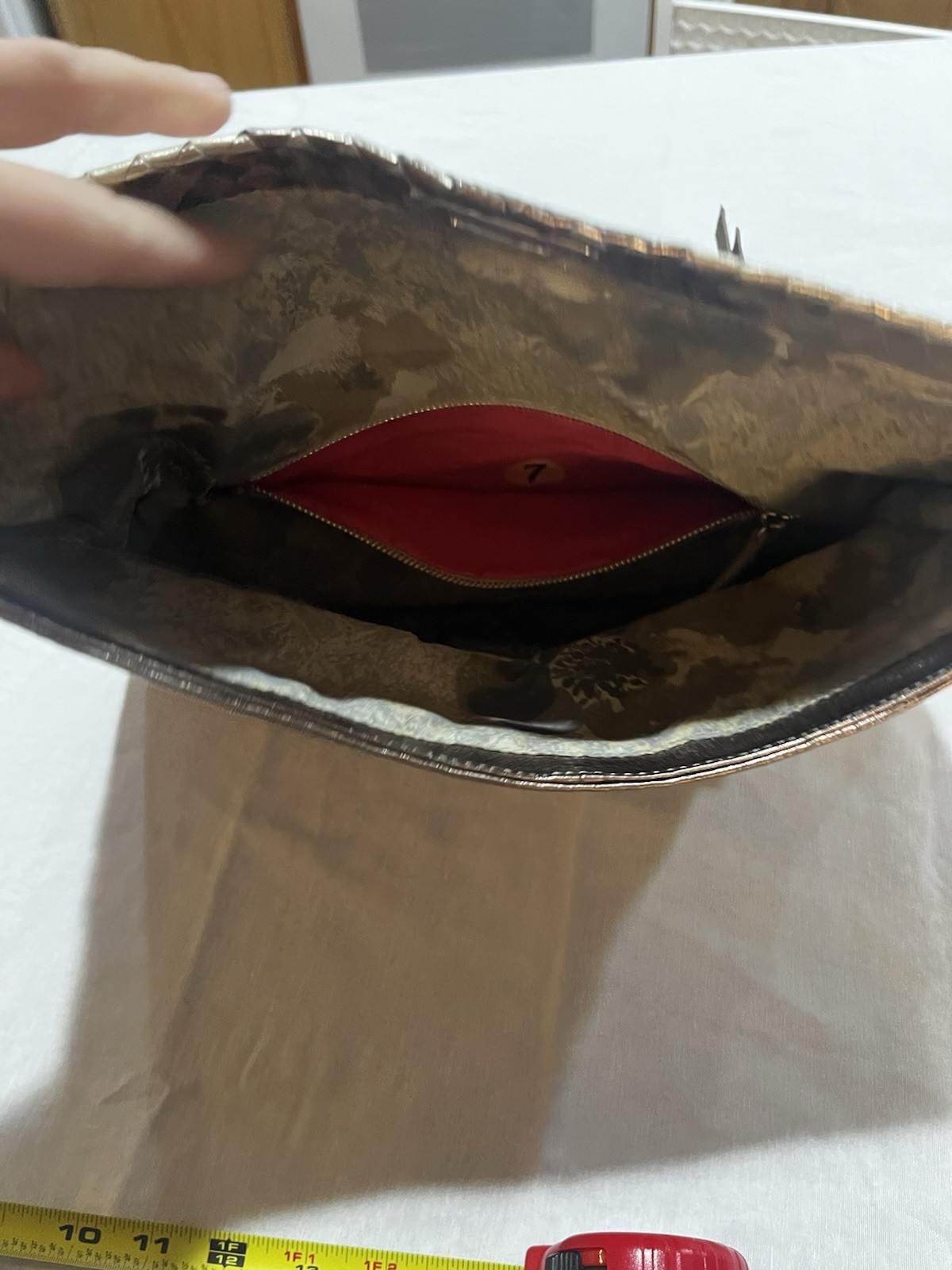 Elliott Lucca metallic woven leather convertible clutch/crossbody bag.