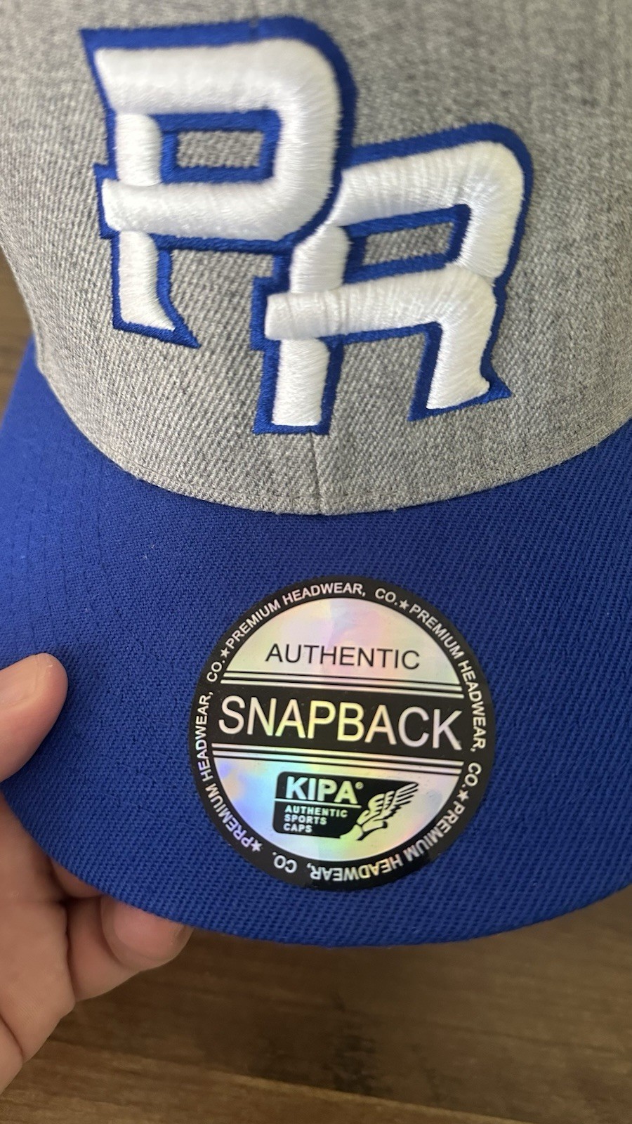 Kipa PR Logo Adjustable Snapback Hat Gray/Blue/White One Size