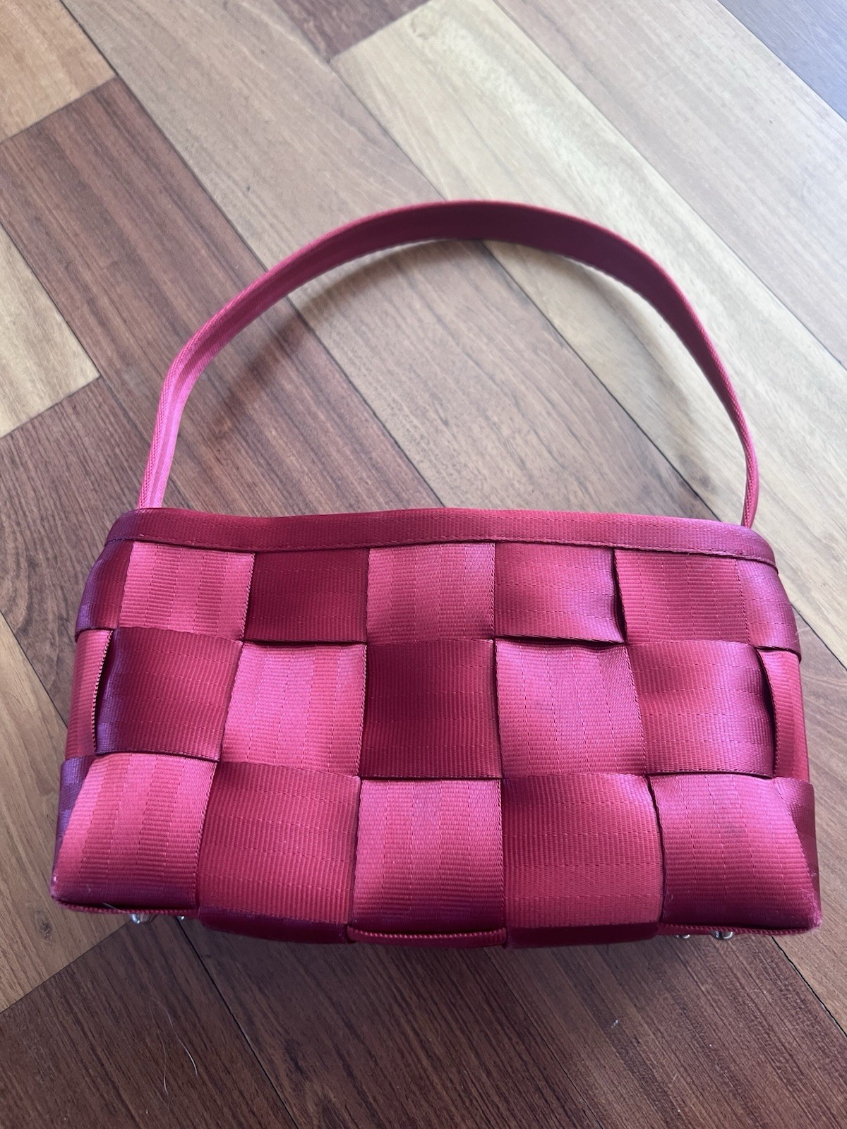 Harvey’s Seatbelt Bag – Ruby Red Baguette Bag
