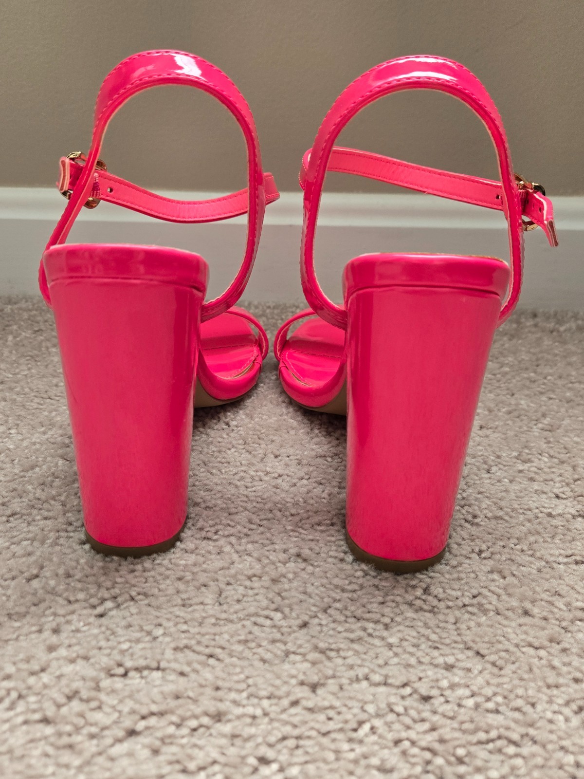 Brand new. Never worn. Pink . Leathery material . Size 6.5 . High heel