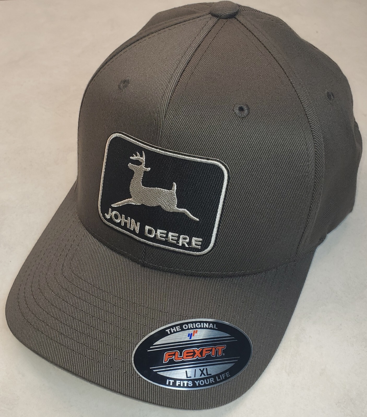 John Deere Black Patch on Flexfit Style 6277 / Charcoal – L/XL 7 1/8″ – 7 5/8″