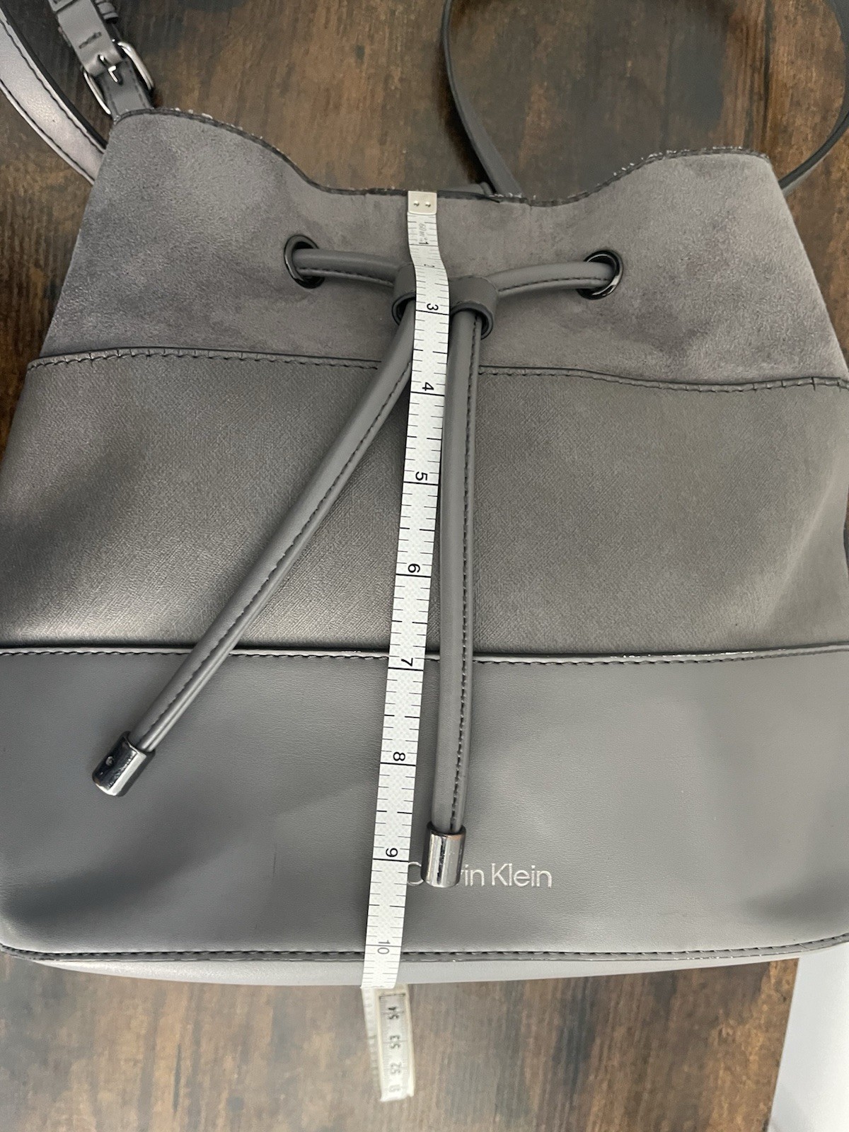 Calvin Klein Gray Drawstring Bucket Crossbody Bag Adjustable Strap Silver Logo