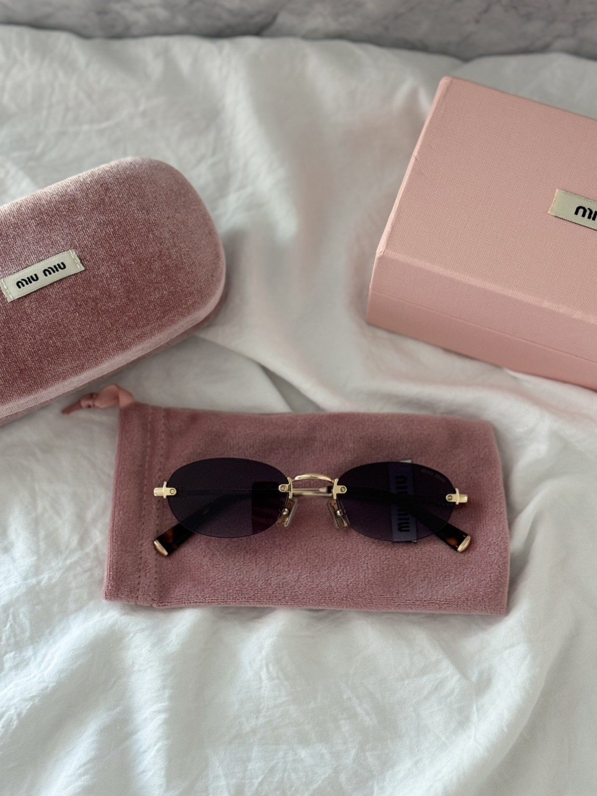 MIU MIU MU A54S ZVN5D1 Pale Gold Grey Gradient Oval Rimless Sunglasses