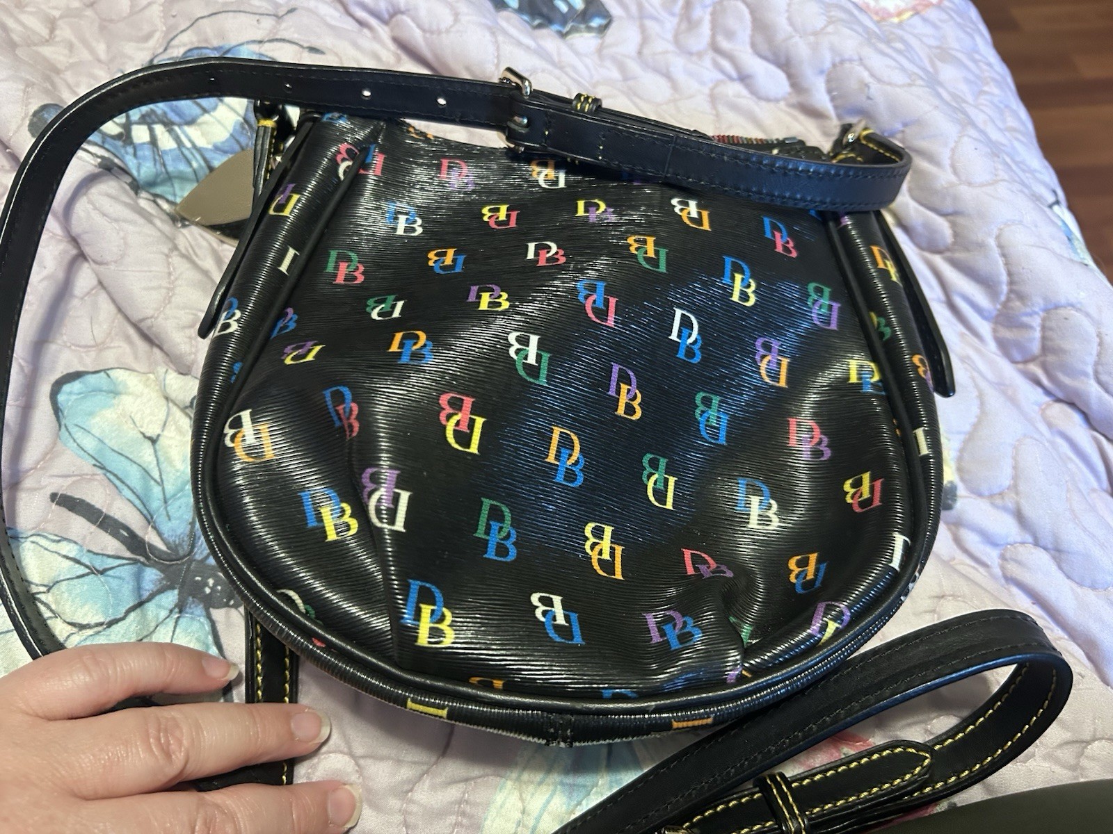 This Dooney & Bourke DB75 Multi rainbow logo crossbody bag